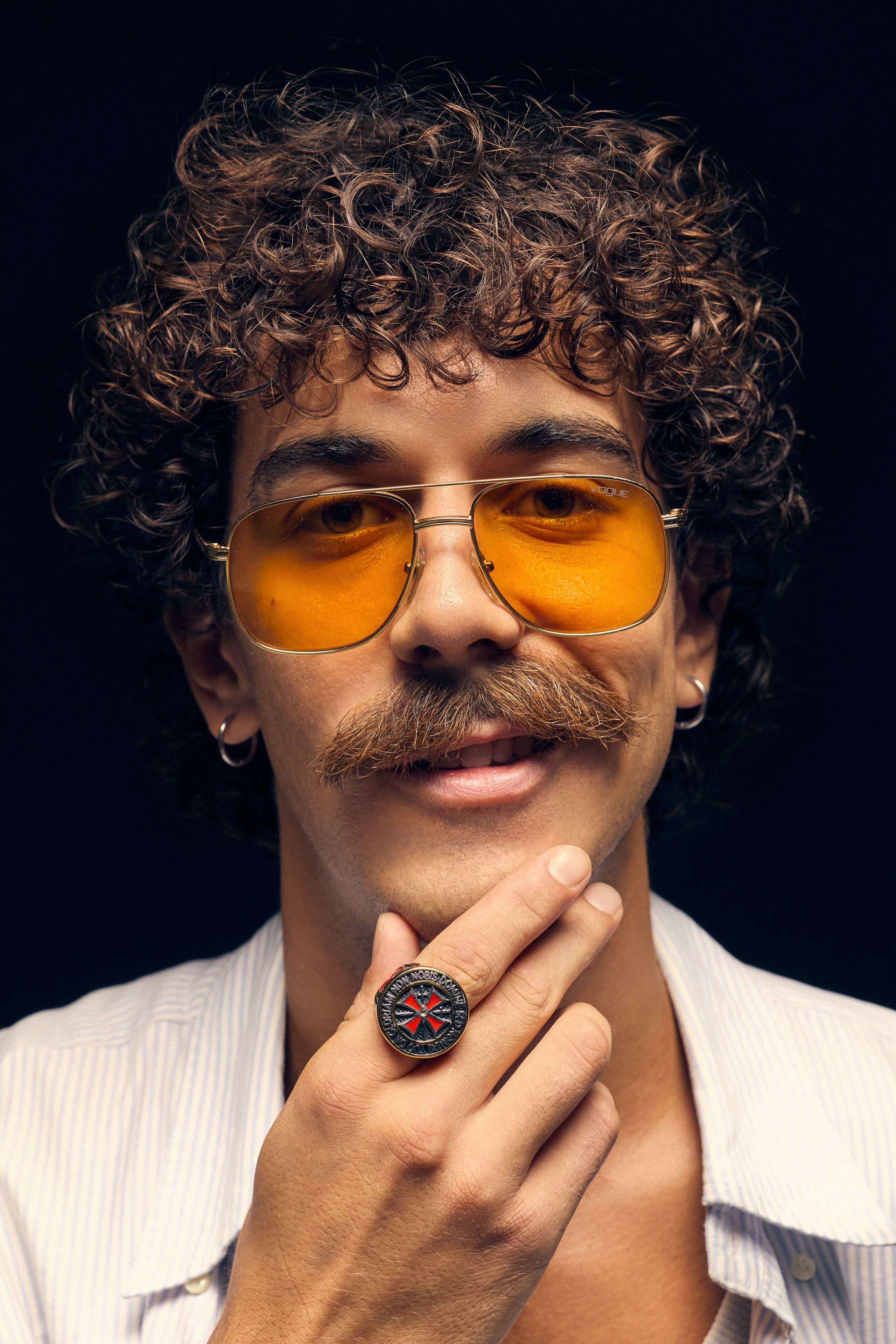 Editorial style photo of man holding flour tray in dramatic lighting