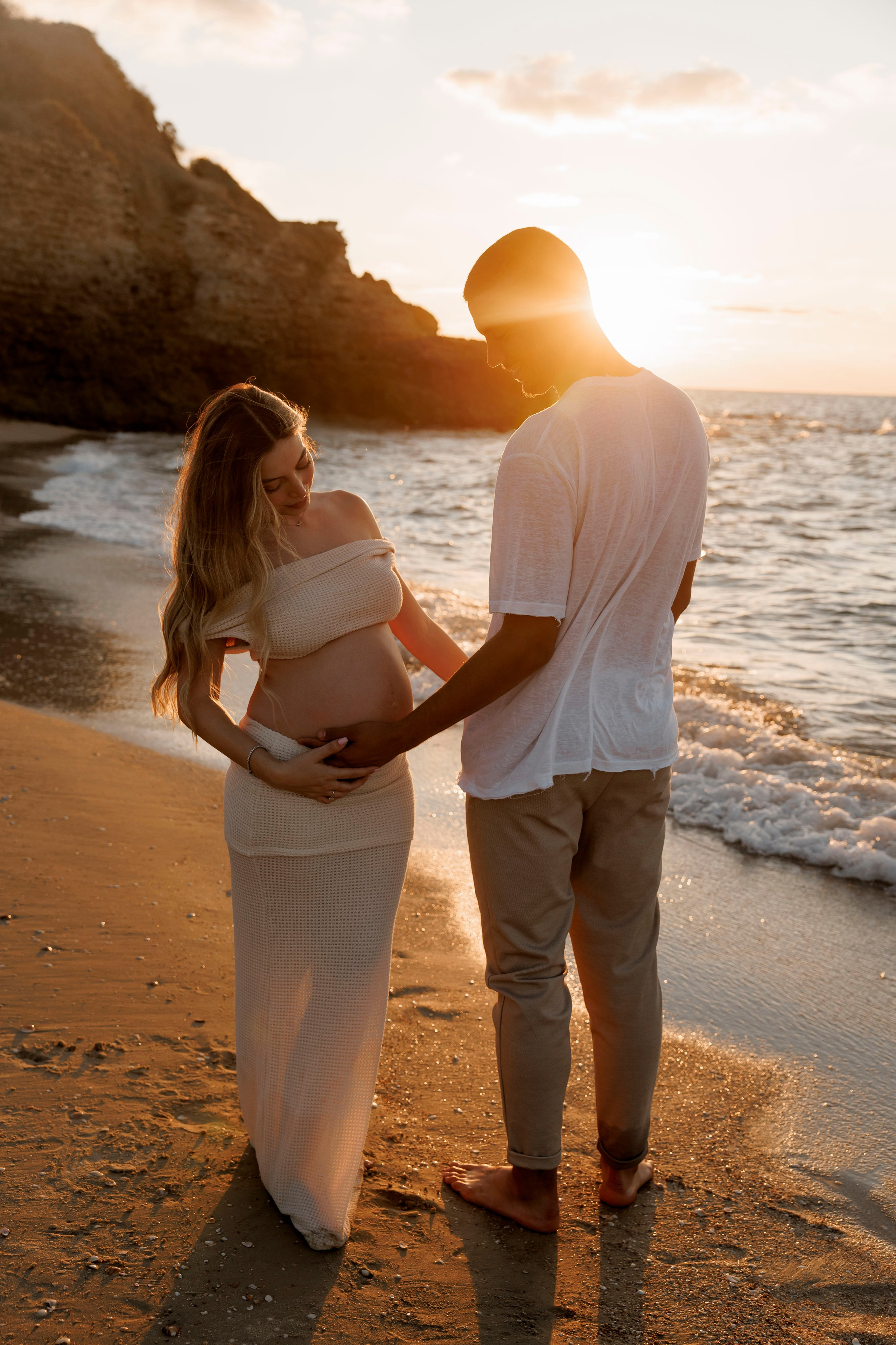 Pregnancy photoshoot near the sea. Wedding and family photographer