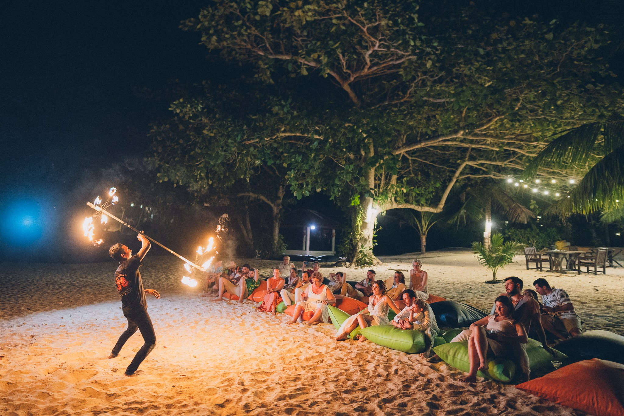Spectacular fire show performance during a beach wedding reception in Koh Samui