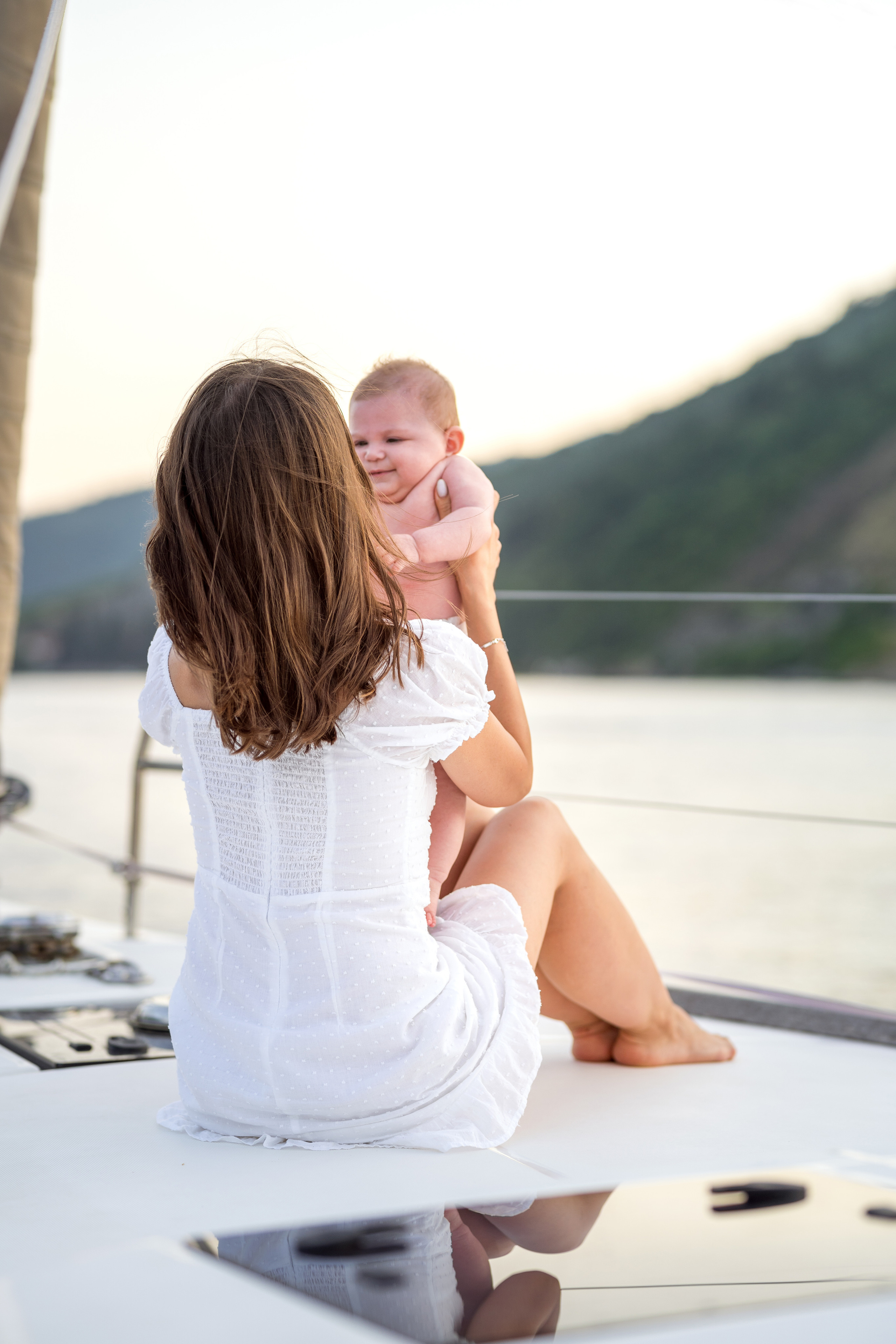 Family photoshoot on a yacht in the Bay of Kotor, Montenegro. Kate Khaldeeva photographer in Saratov