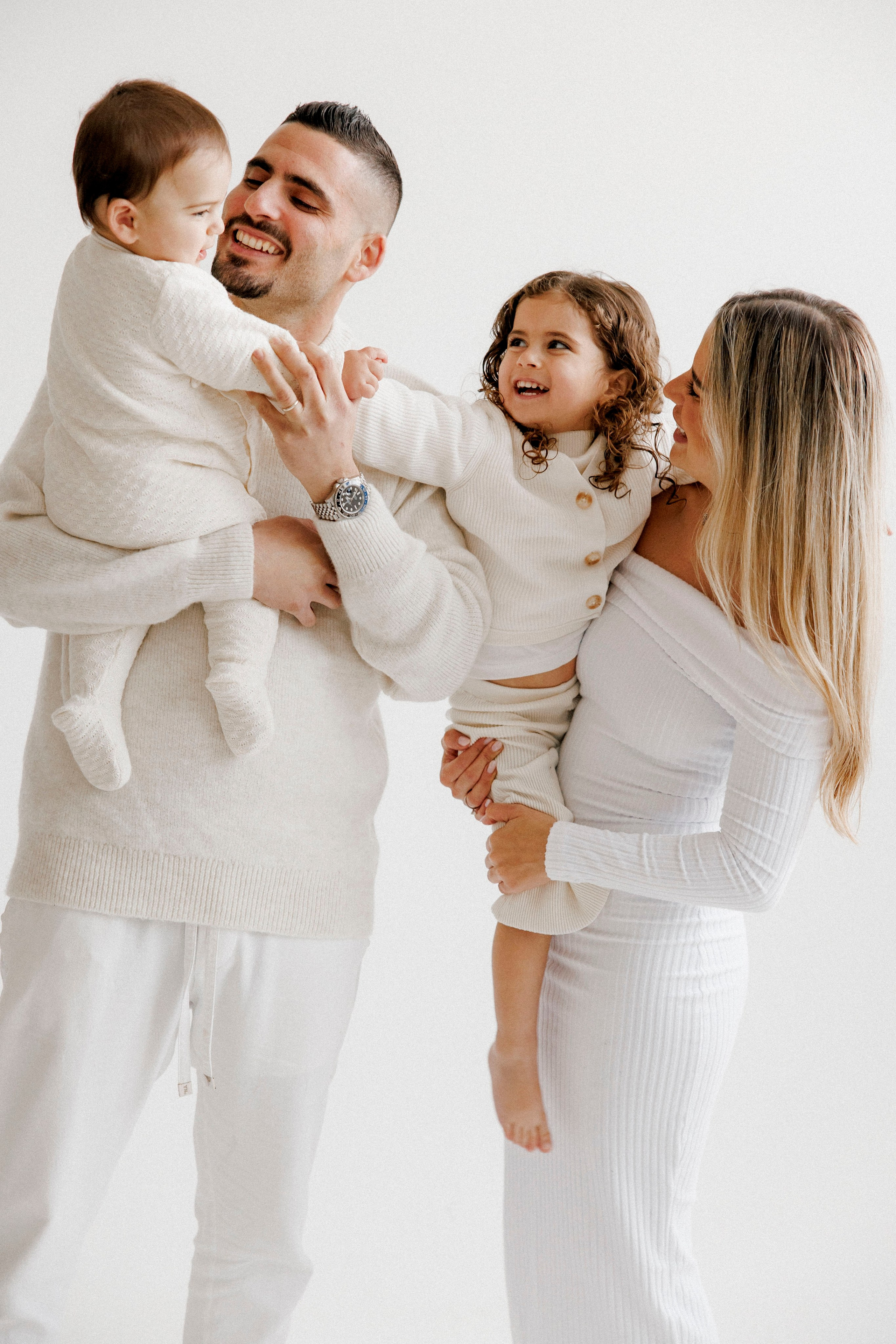 Family photoshoot in White Studio. Wedding and family photographer