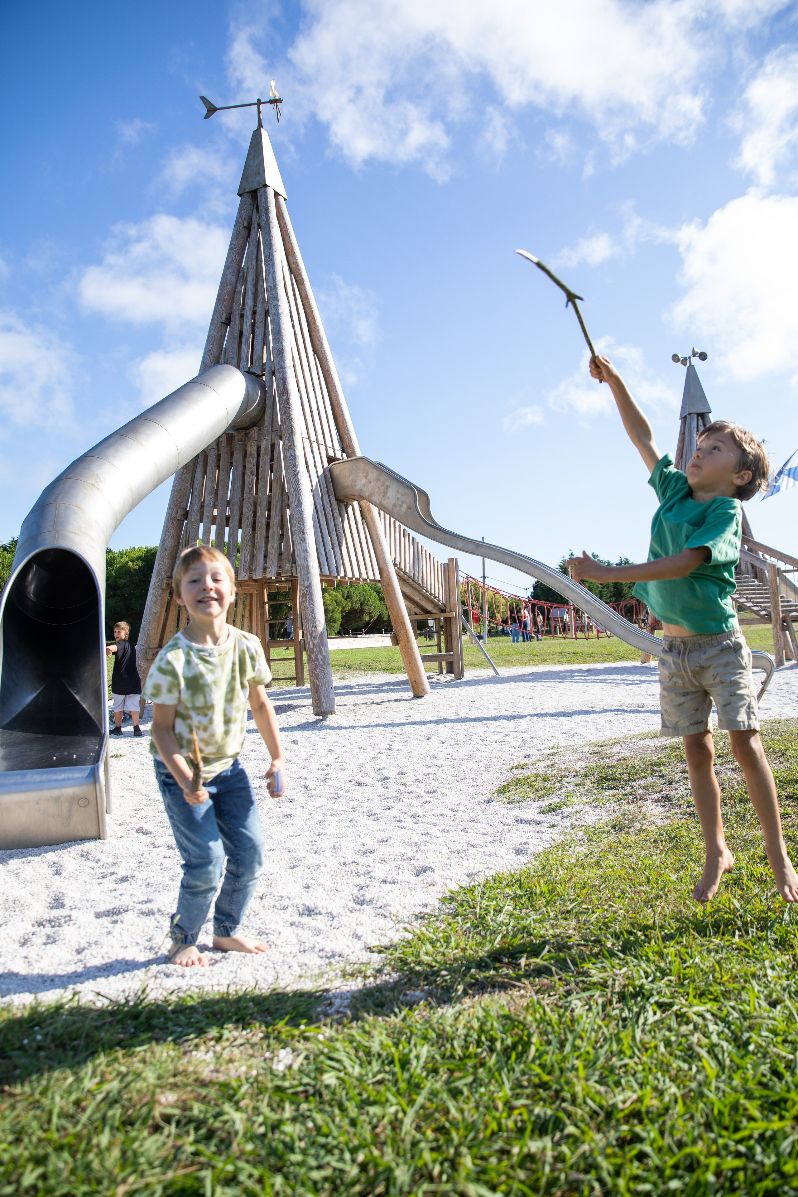 Park birthday photo shoot with kids having fun and soap bubbles in the air