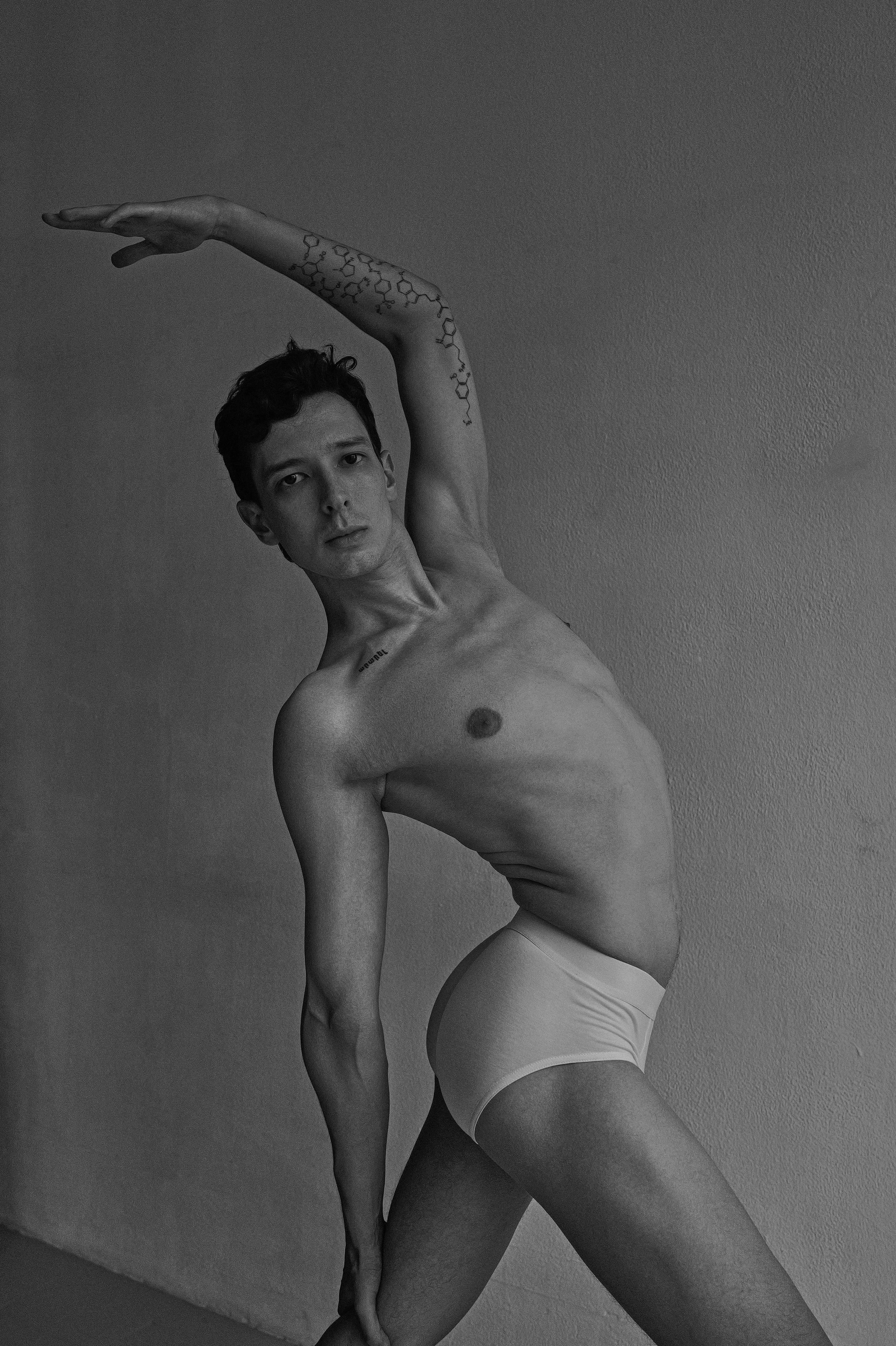 Barcelona black and white photo of man’s creative yoga movement on floor