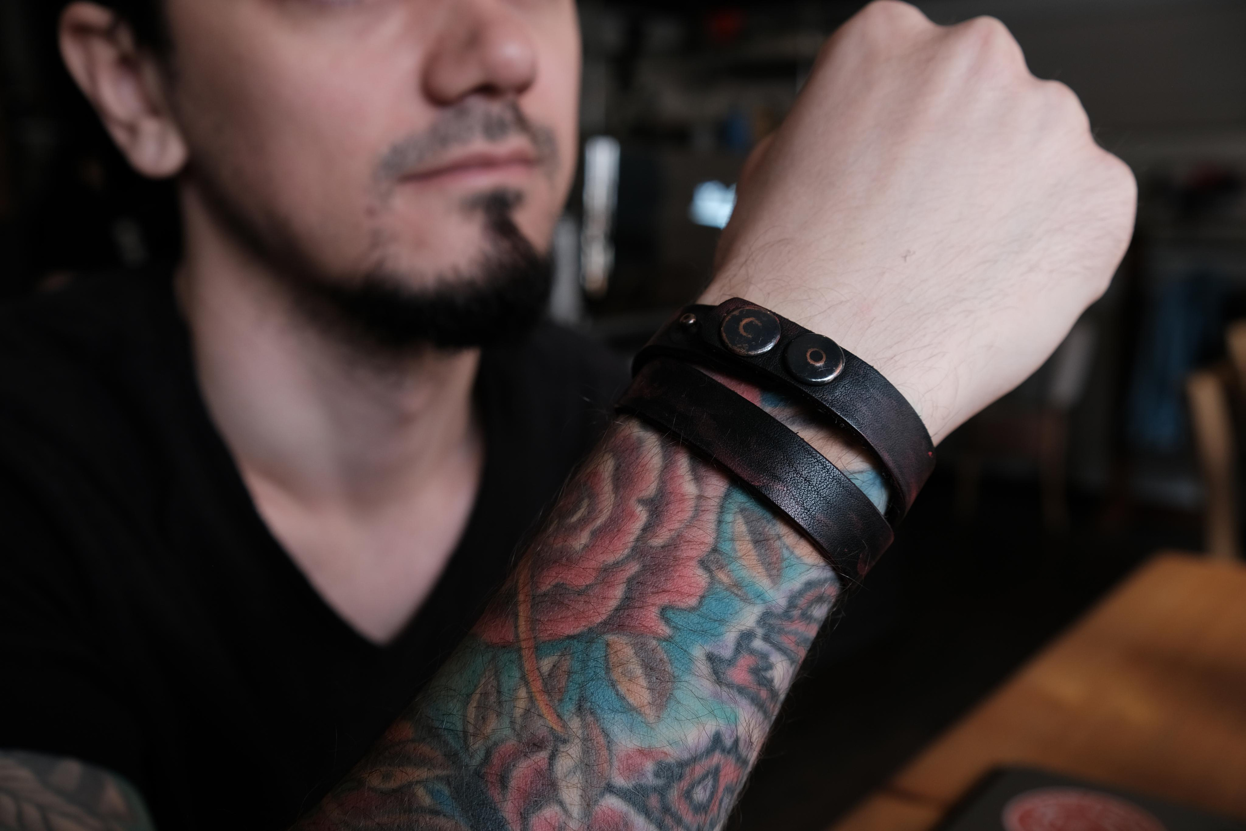 Wrist band bracelet covered in red paint.