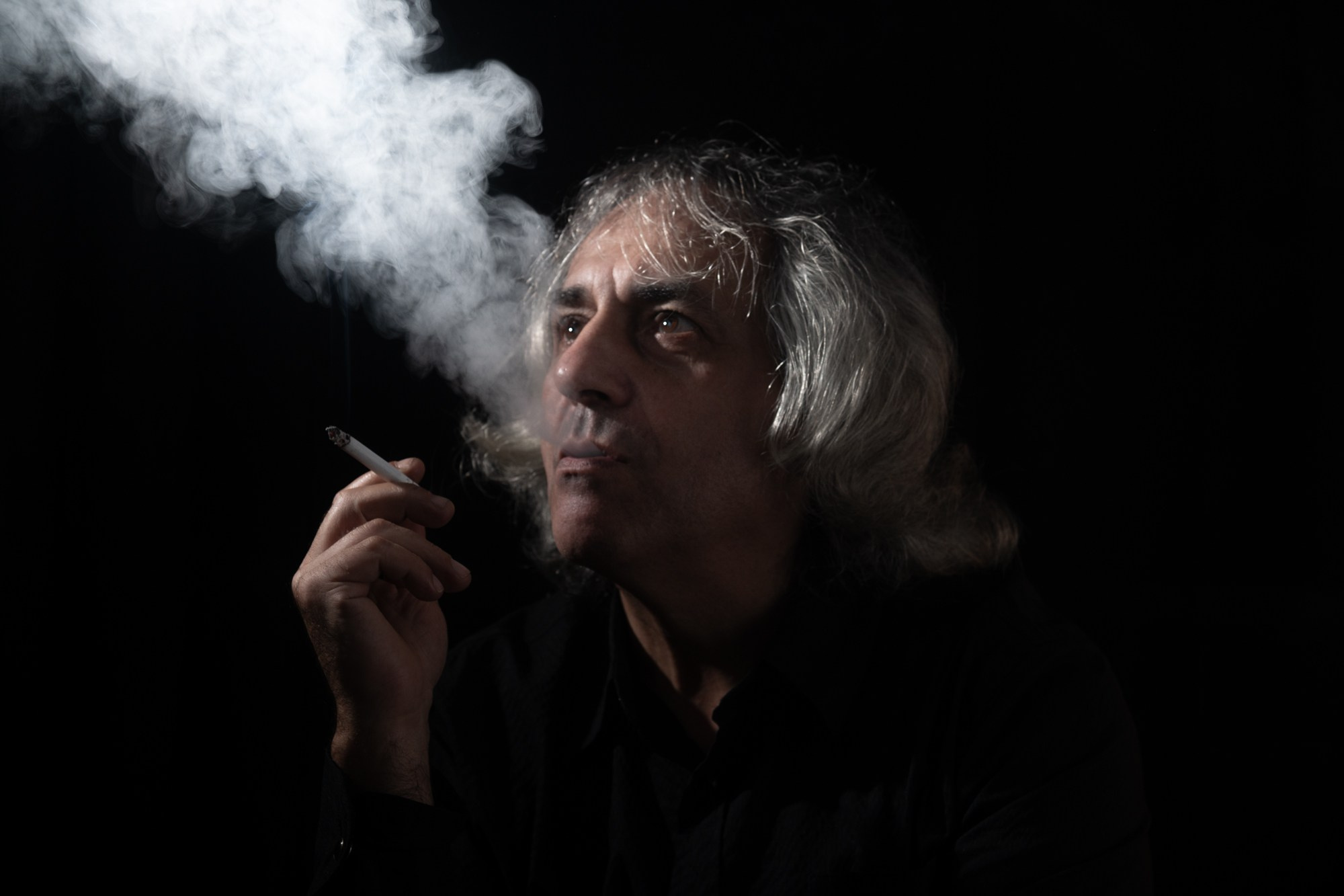 dramatic portrait noir style man person studio low key smoking cigarette smoke Rehovot Israel