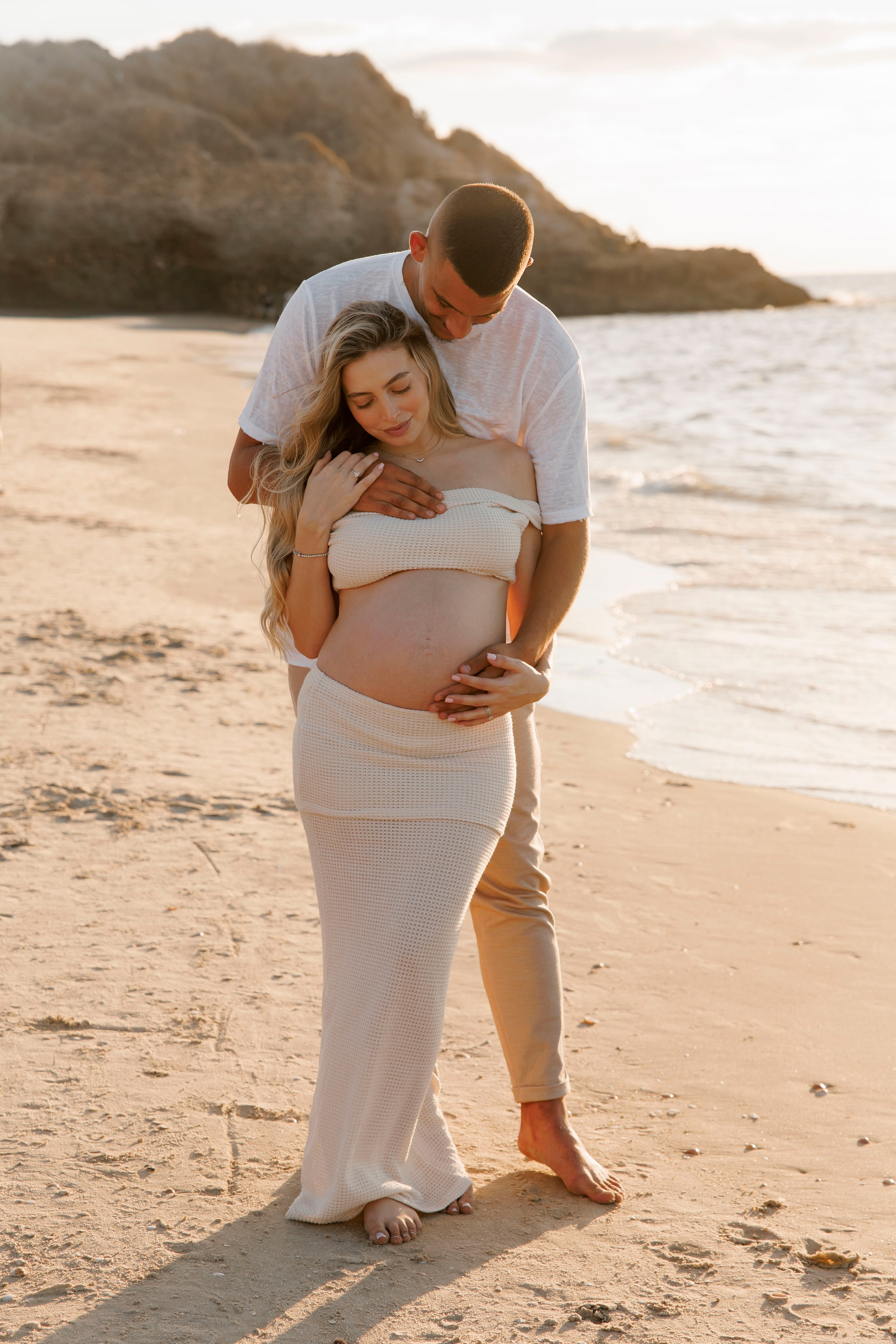 Pregnancy photoshoot near the sea. Wedding and family photographer