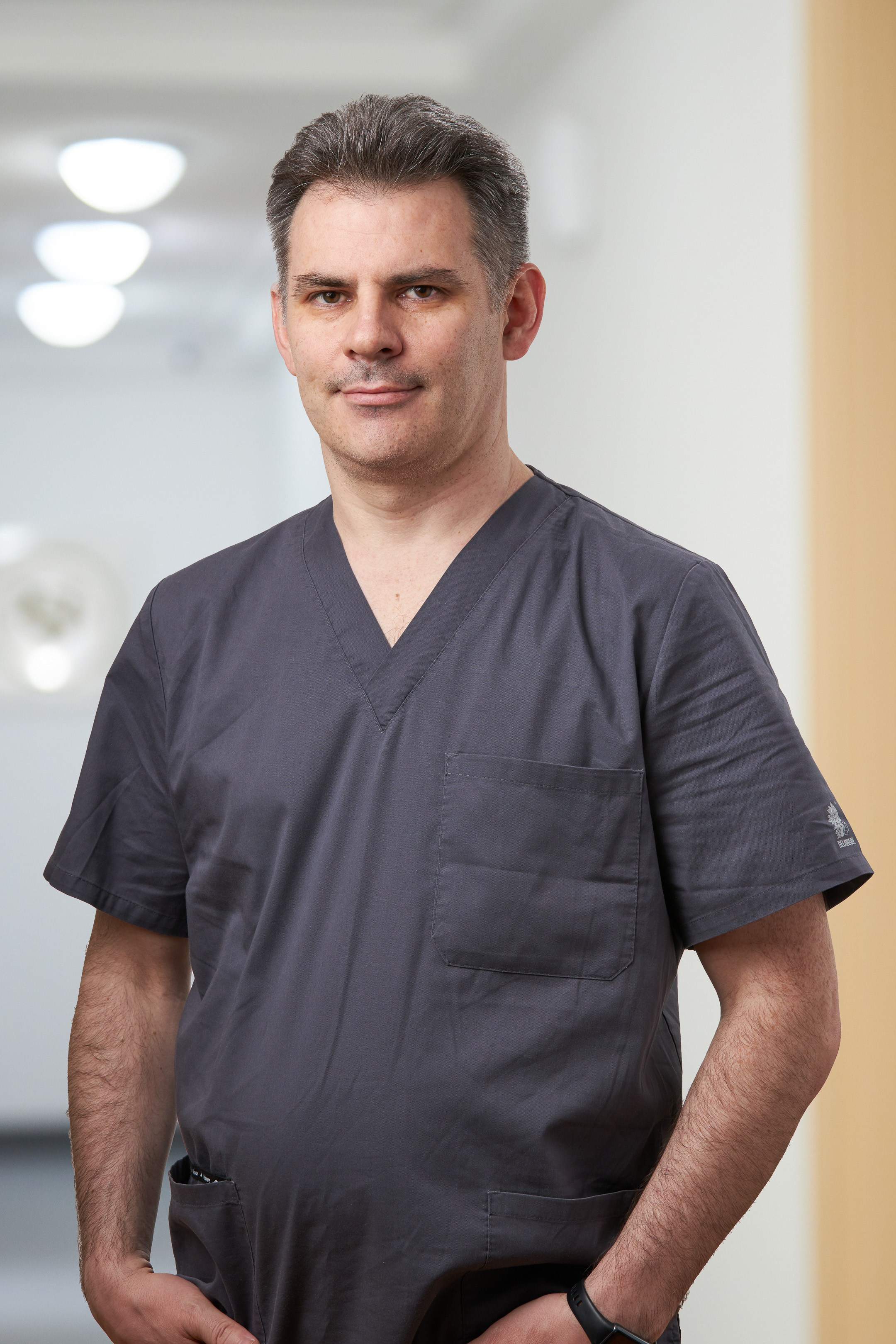 Business portrait of a doctor against a blurred interior background - photographer Andrey Dunin