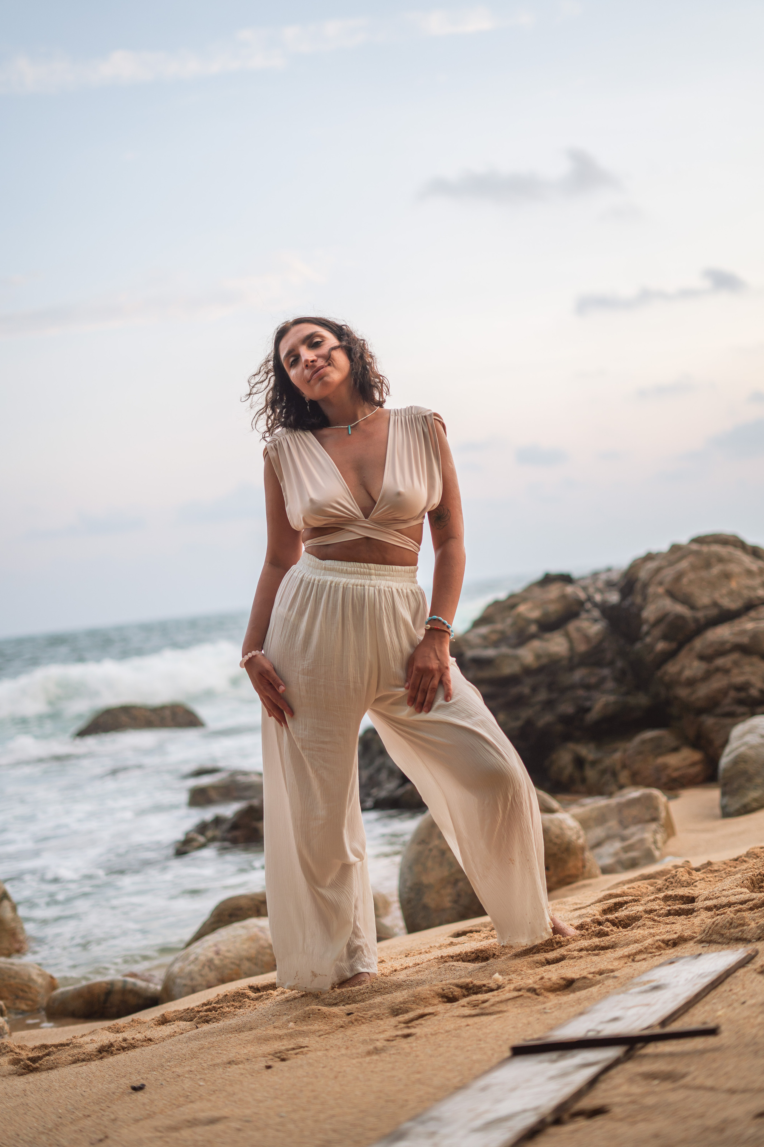 a beautiful brunette posing on the shore of the Indian Ocean