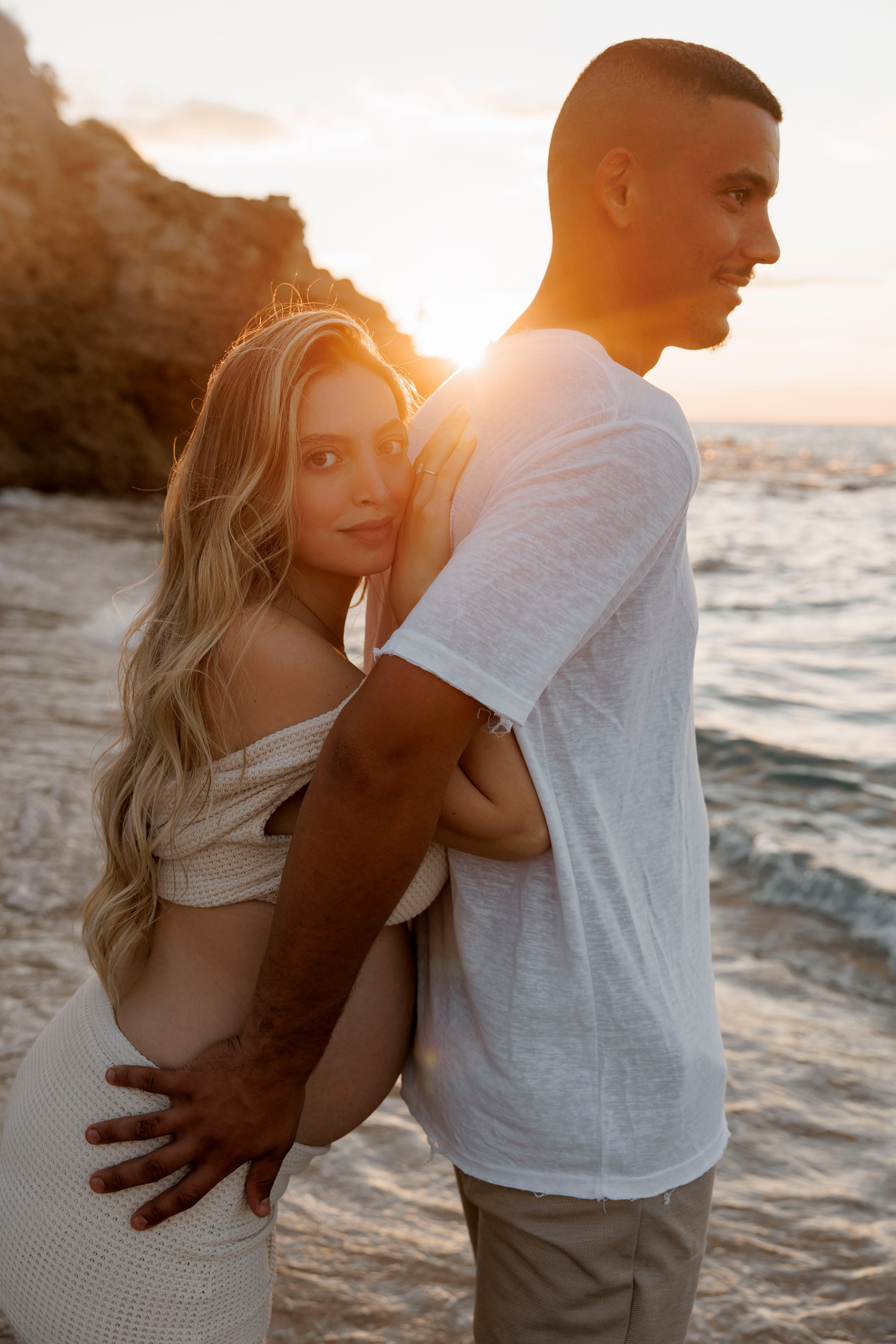 Pregnancy photoshoot near the sea. Wedding and family photographer