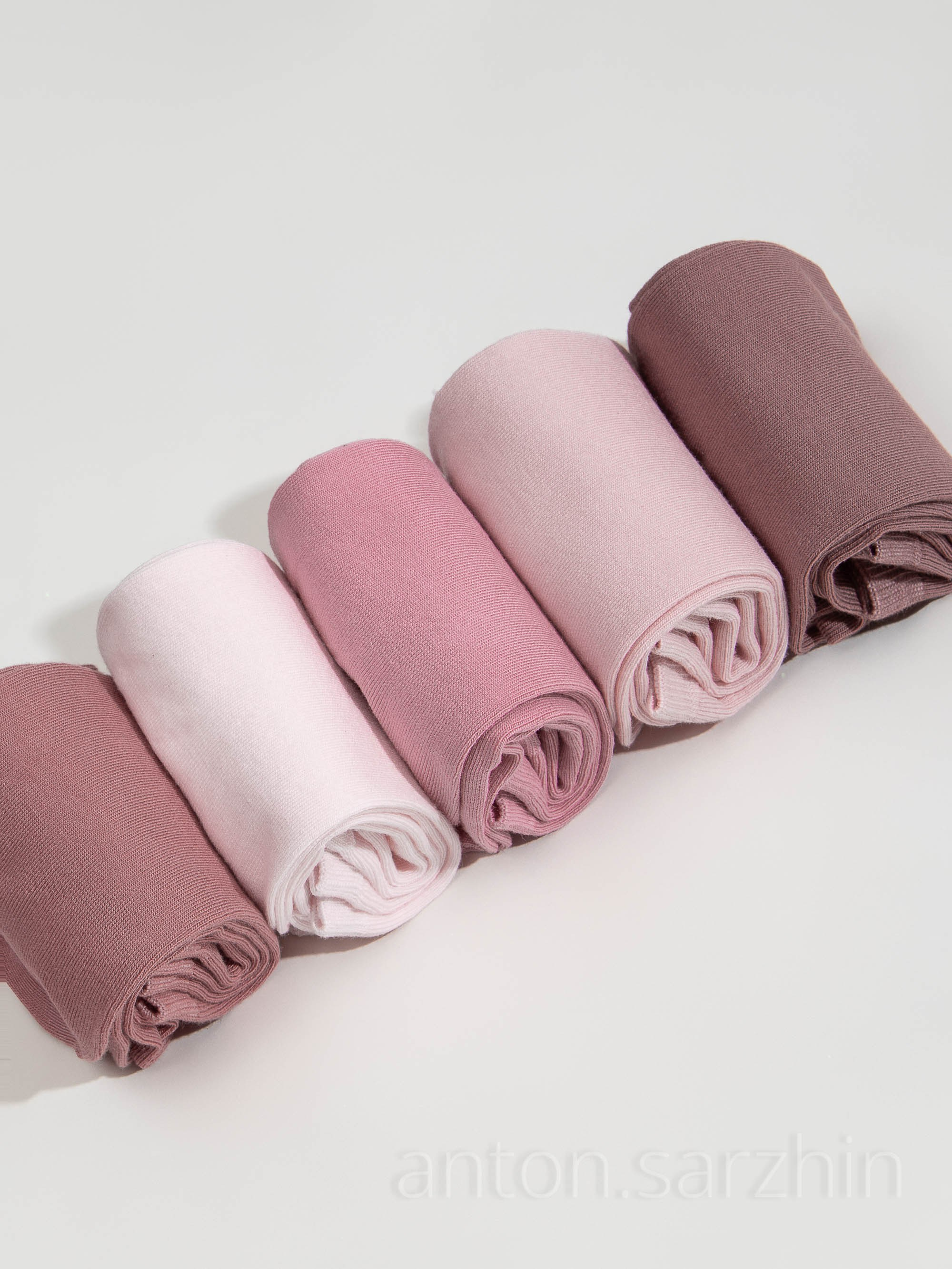 Предметное фото скрученных носков