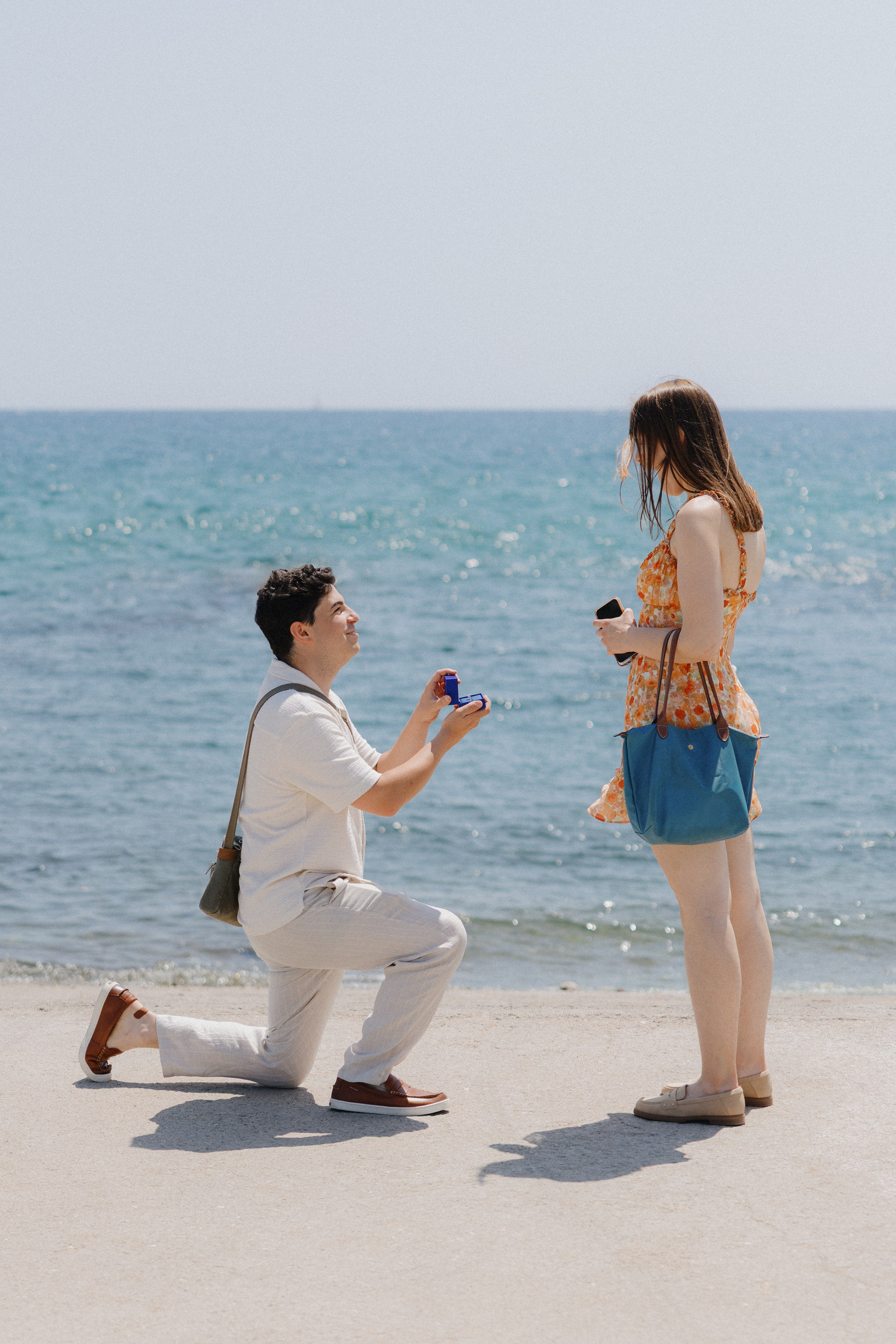 Surprise proposal in Barcelona at sunrise with city view