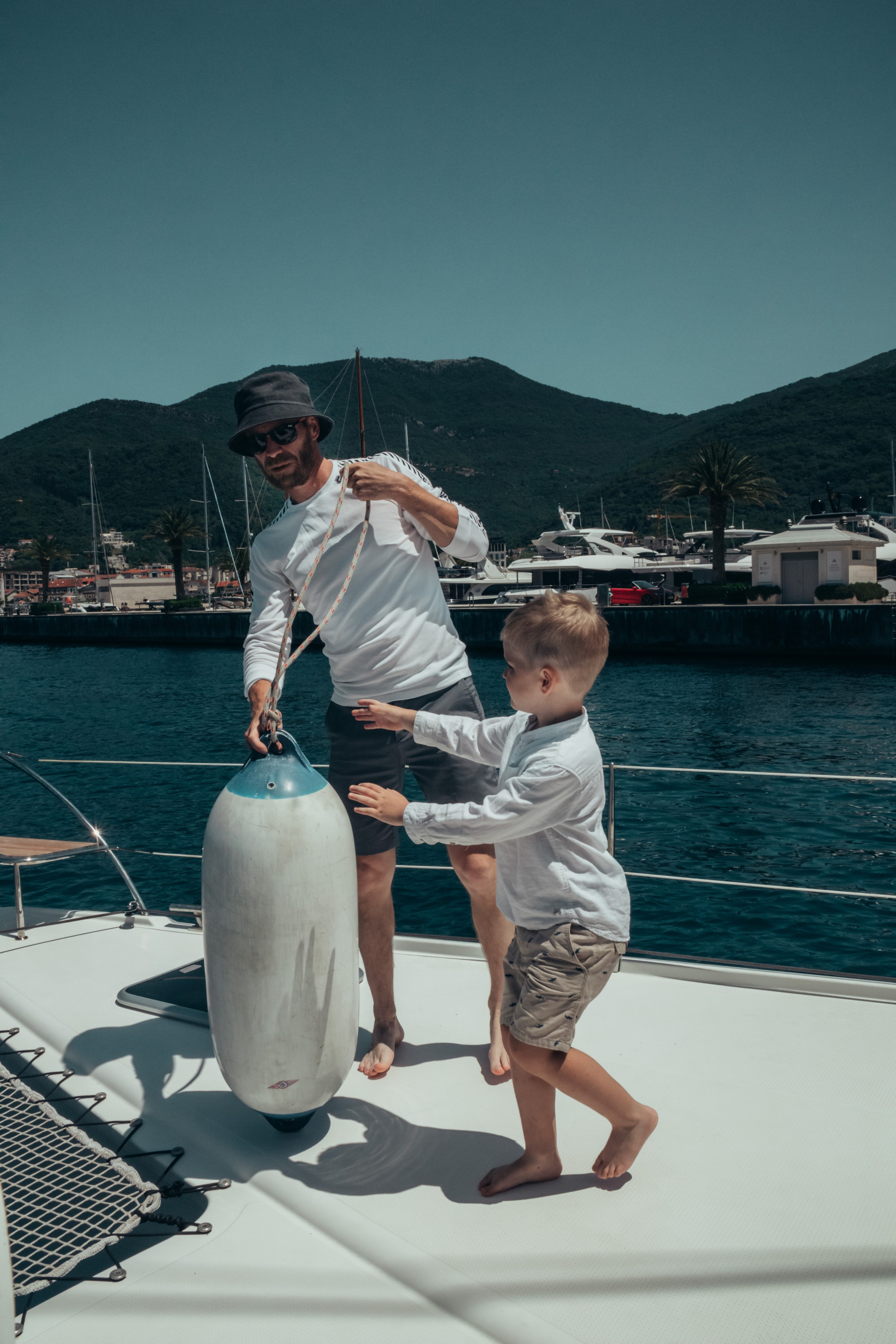 Boat tour with Anna, Roman and Tim. Portrait photographer in Tivat Montenegro Katerina Kirsanova