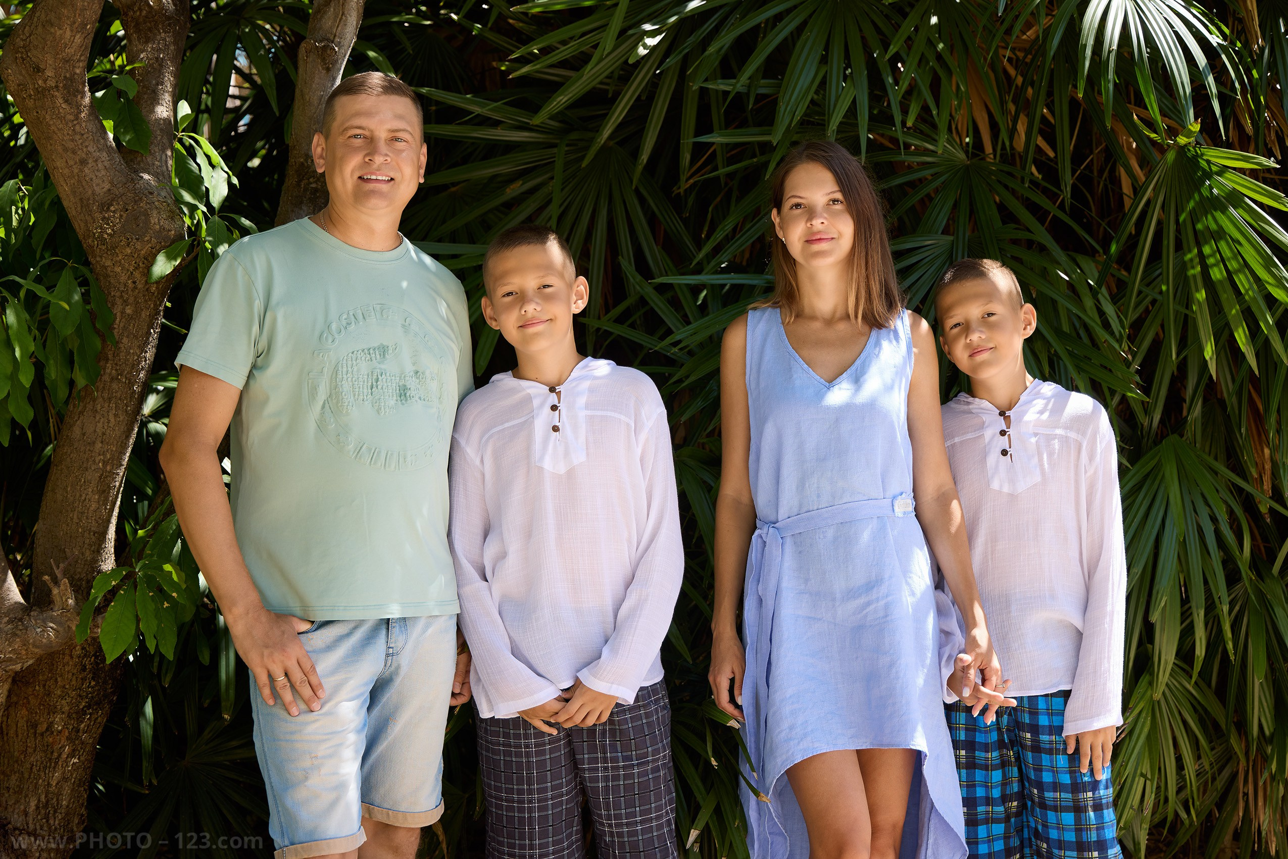 Family portrait with twin boys against dense tropical foliage | Nha Trang photographer Dima