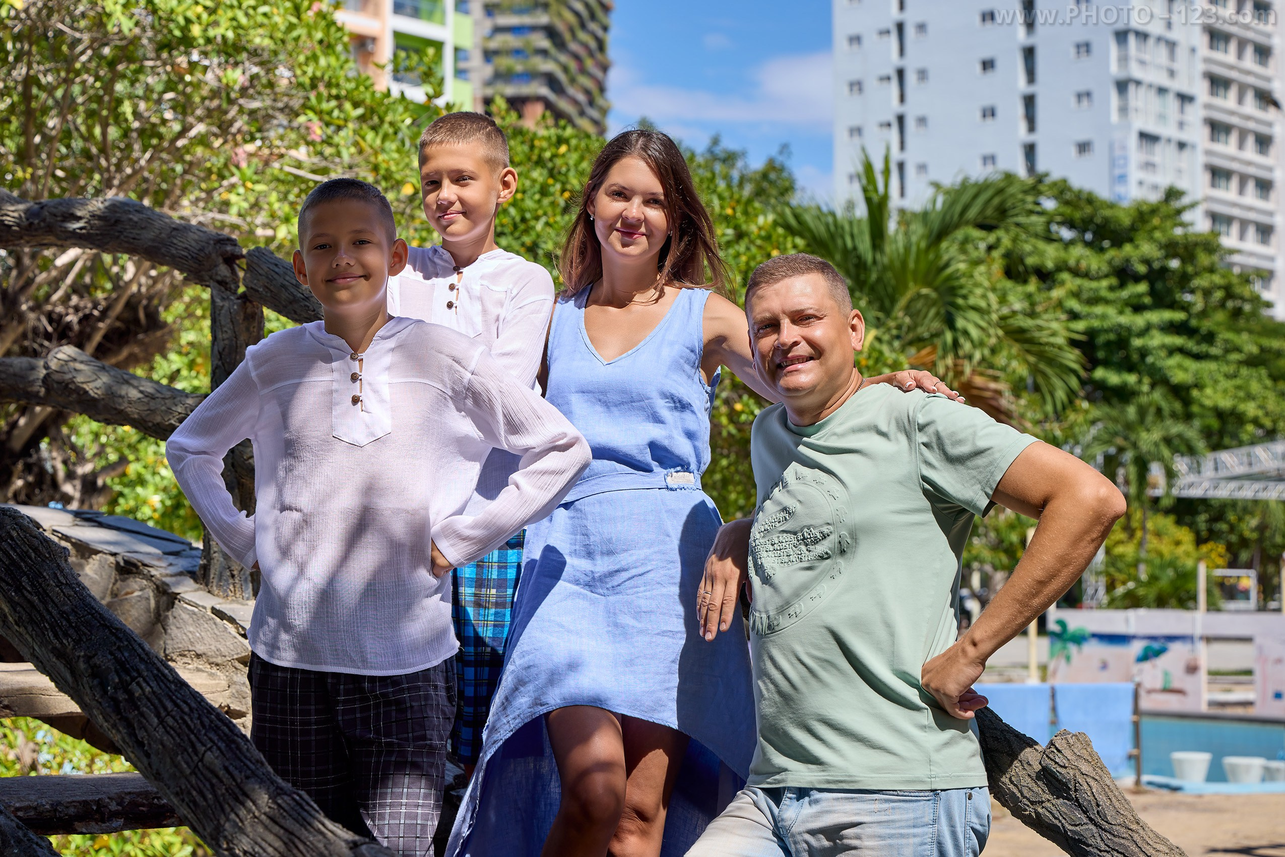 Happy family of four portrait in Nha Trang | Professional family photoshoot by Dima