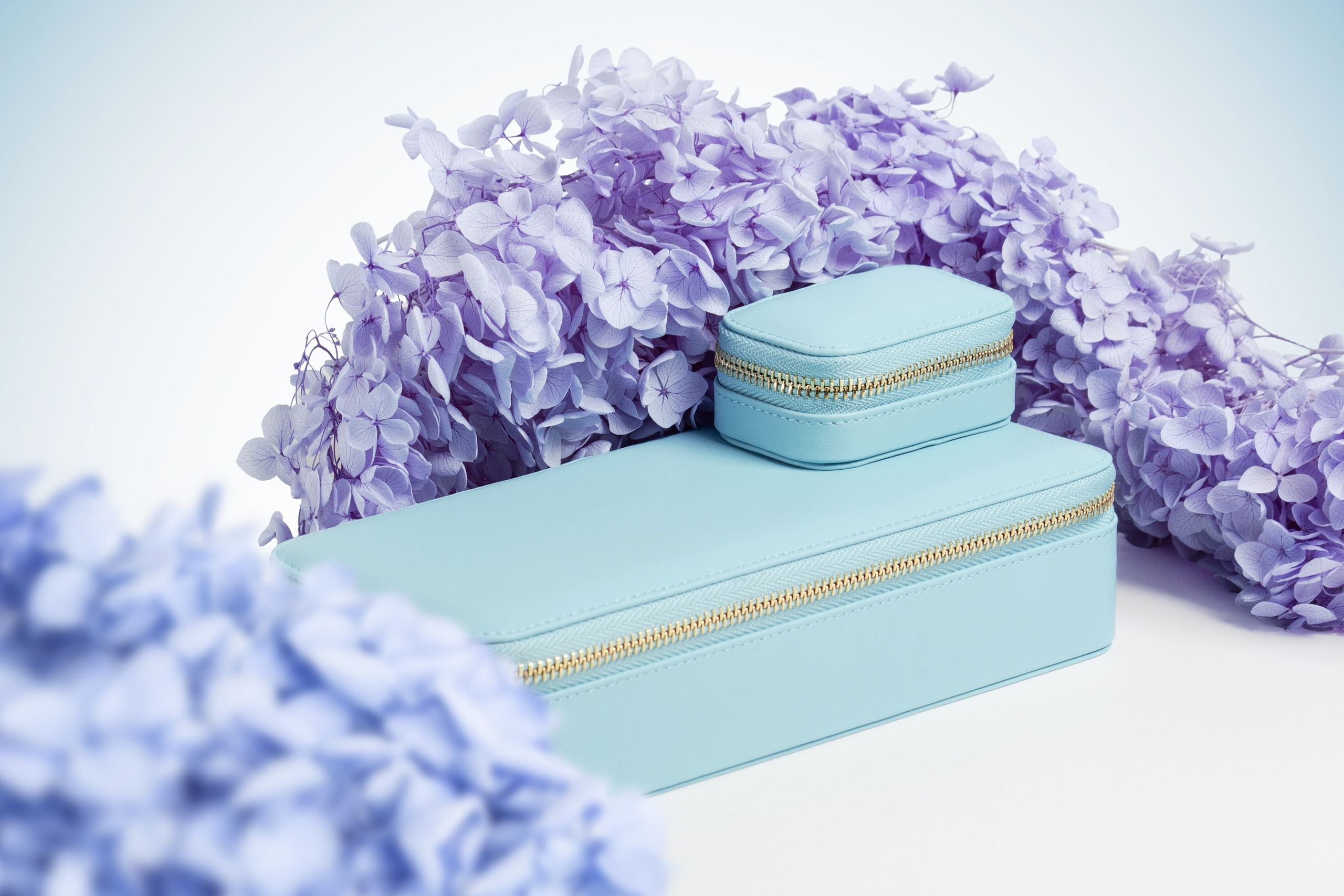 Professional product photos Georgia — cosmetics box with flowers lifestyle shot