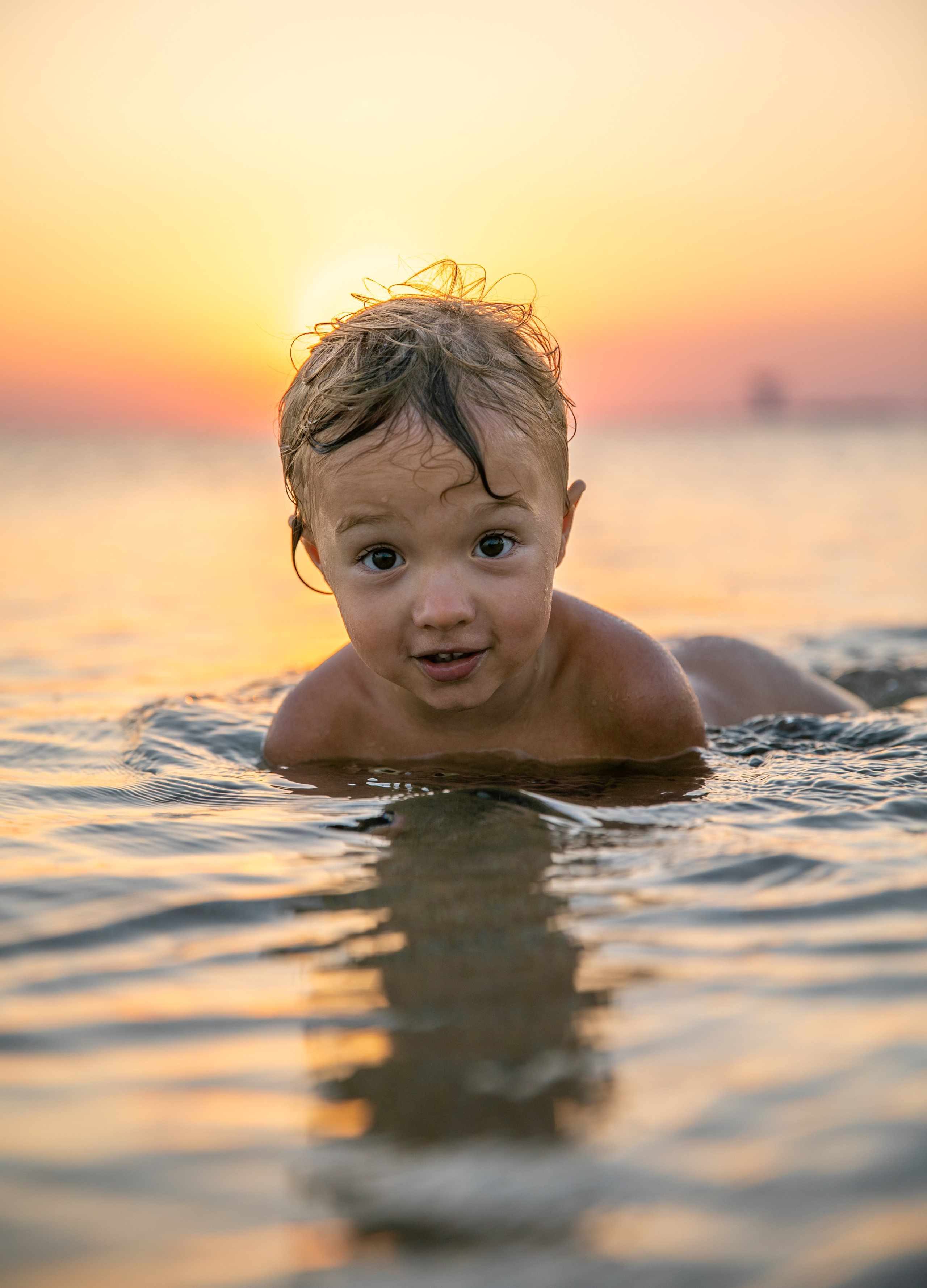 On the sea beach and playground with a little boy