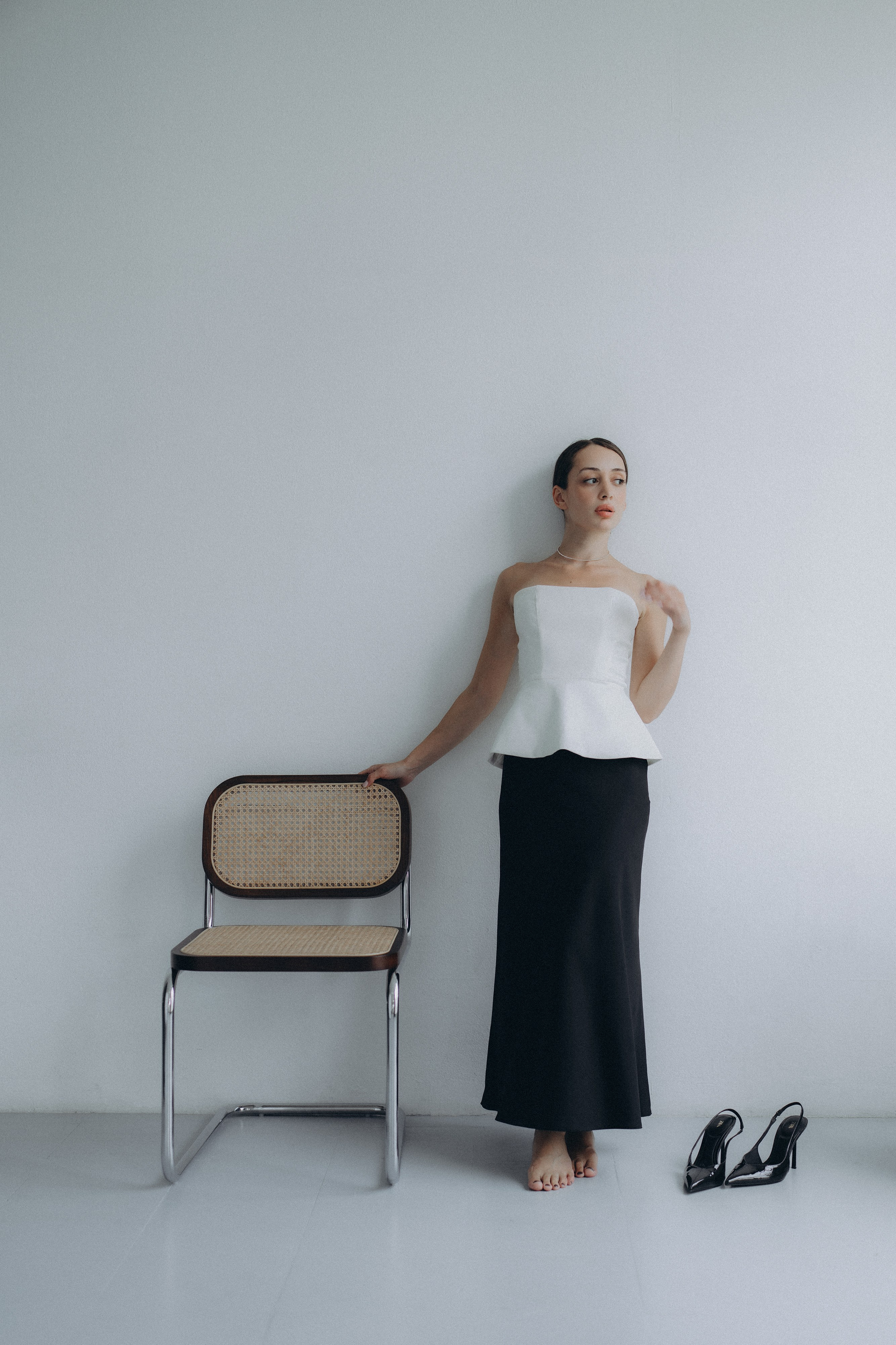 Photoshoot of a woman by the window in natural light