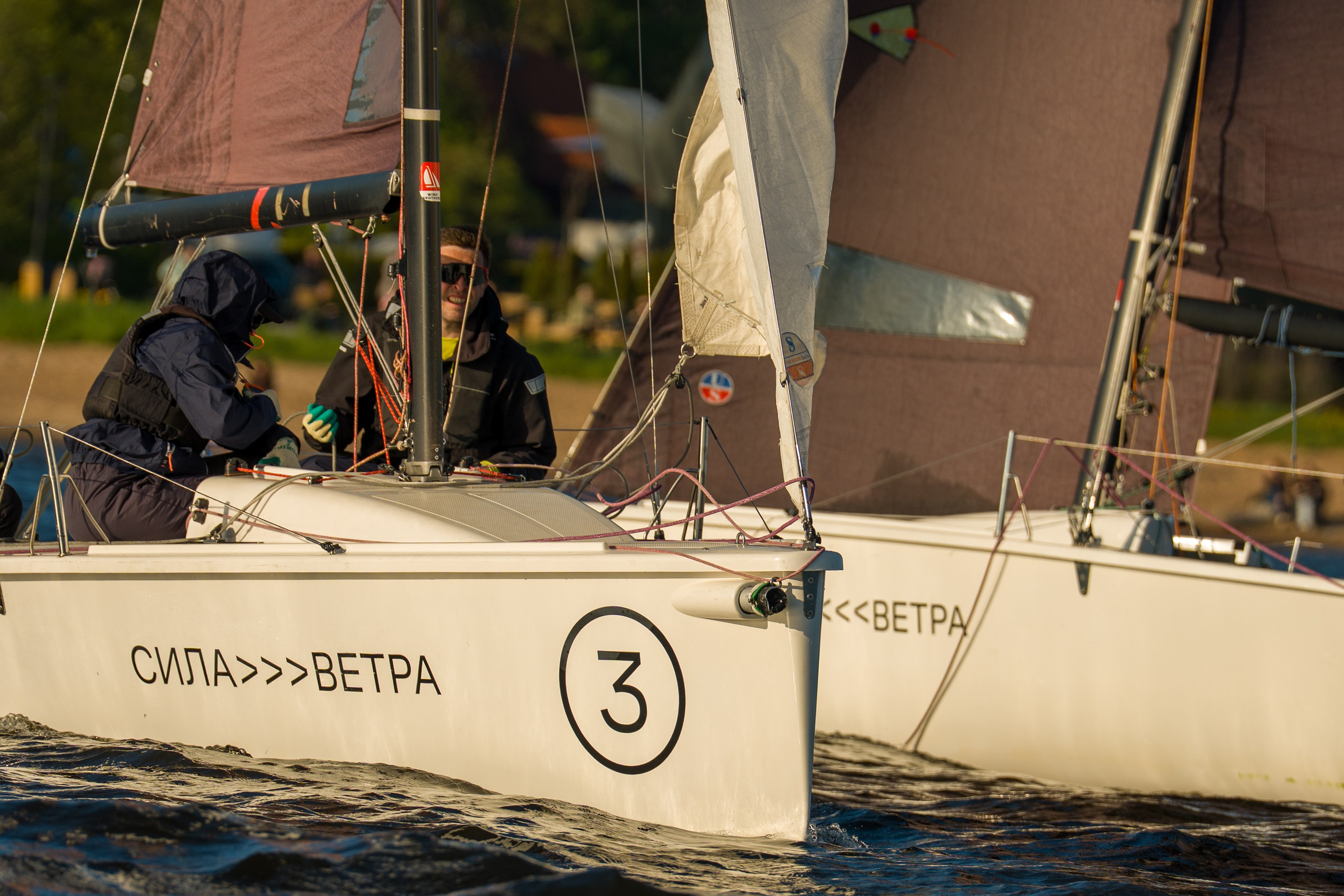Sila Vetra SV20 crews trim sheets side by side on the course