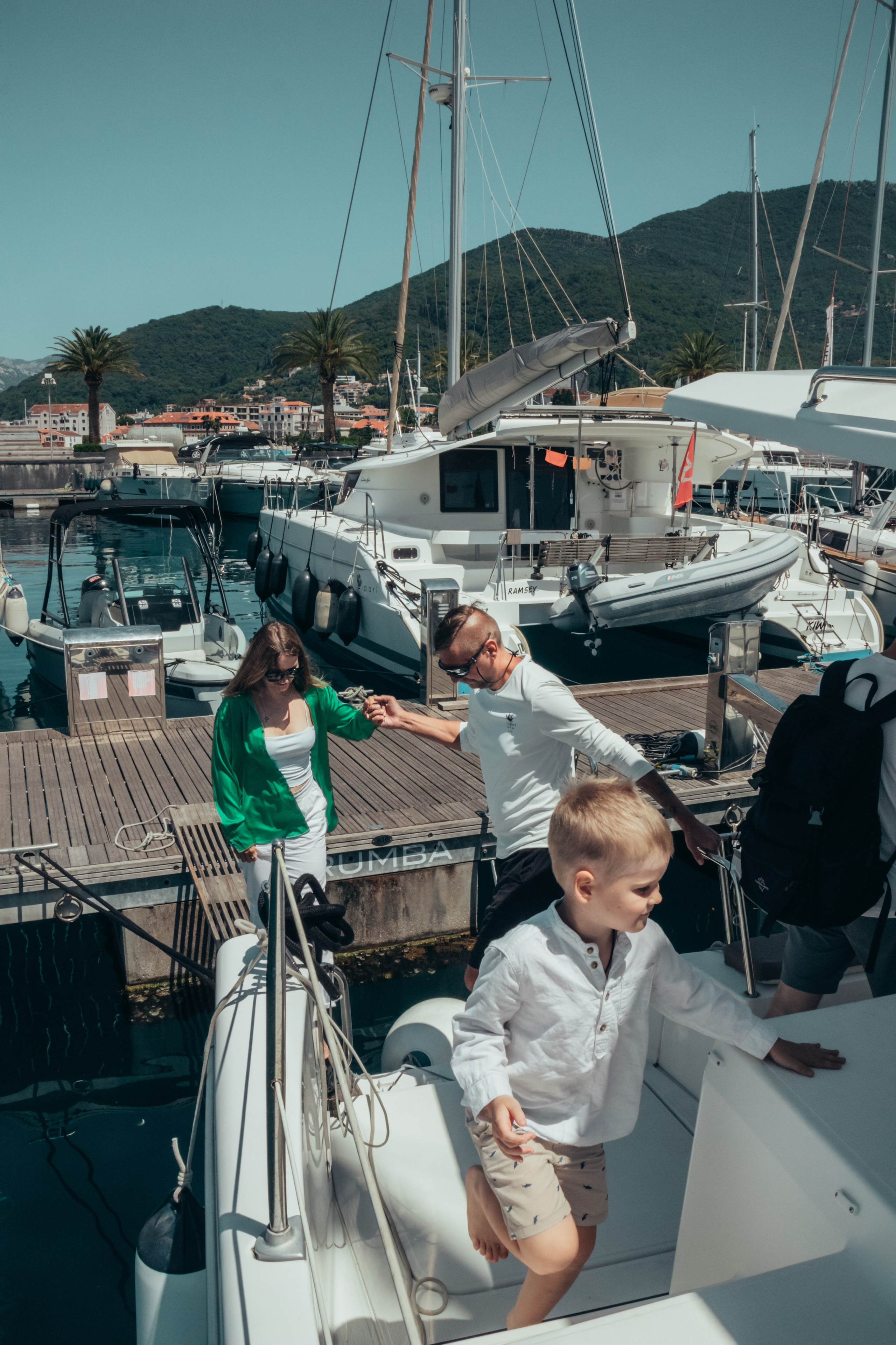 Boat tour with Anna, Roman and Tim. Portrait photographer in Tivat Montenegro Katerina Kirsanova