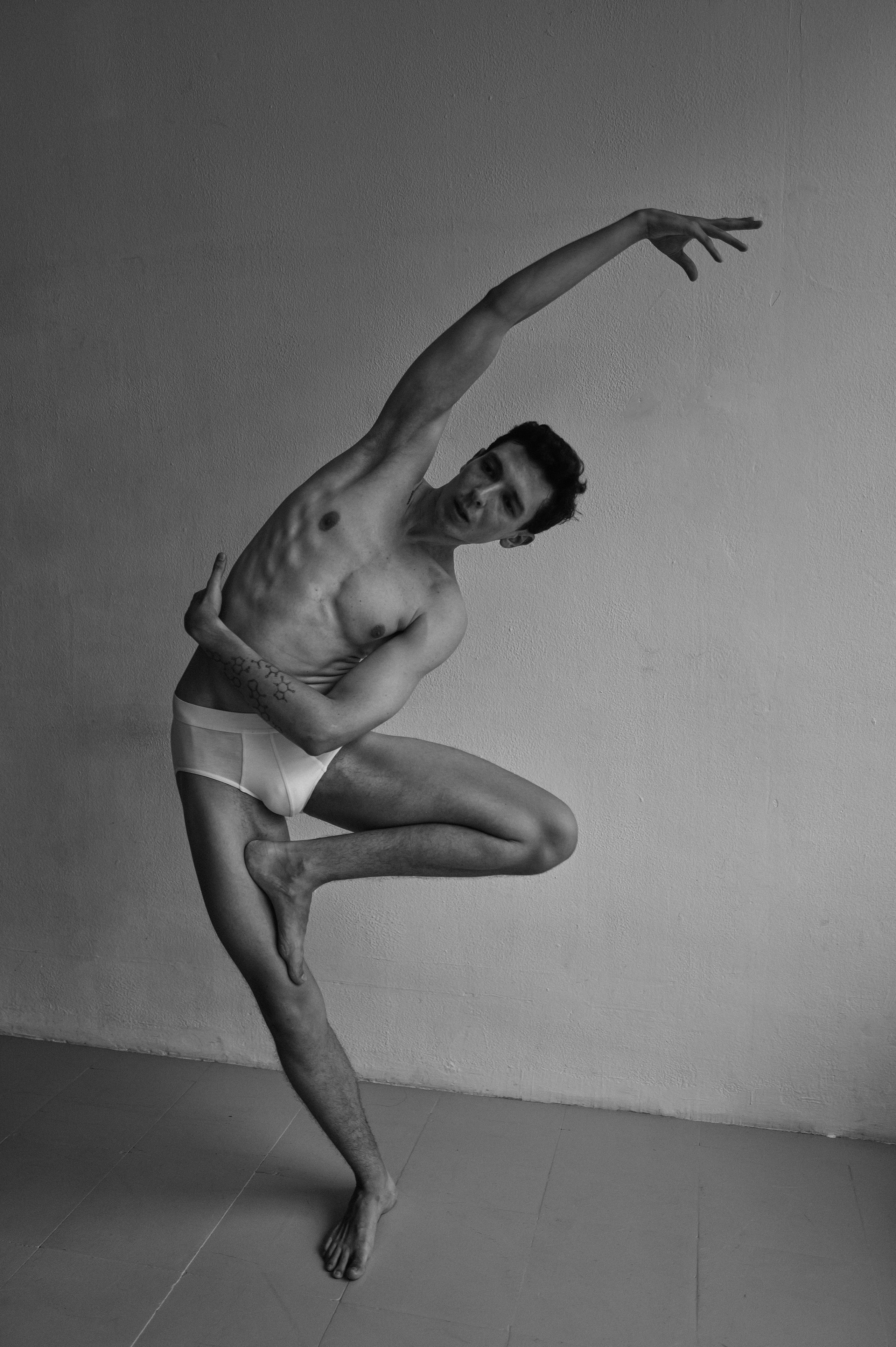 Barcelona artistic photo of a man performing advanced yoga balance on blocks
