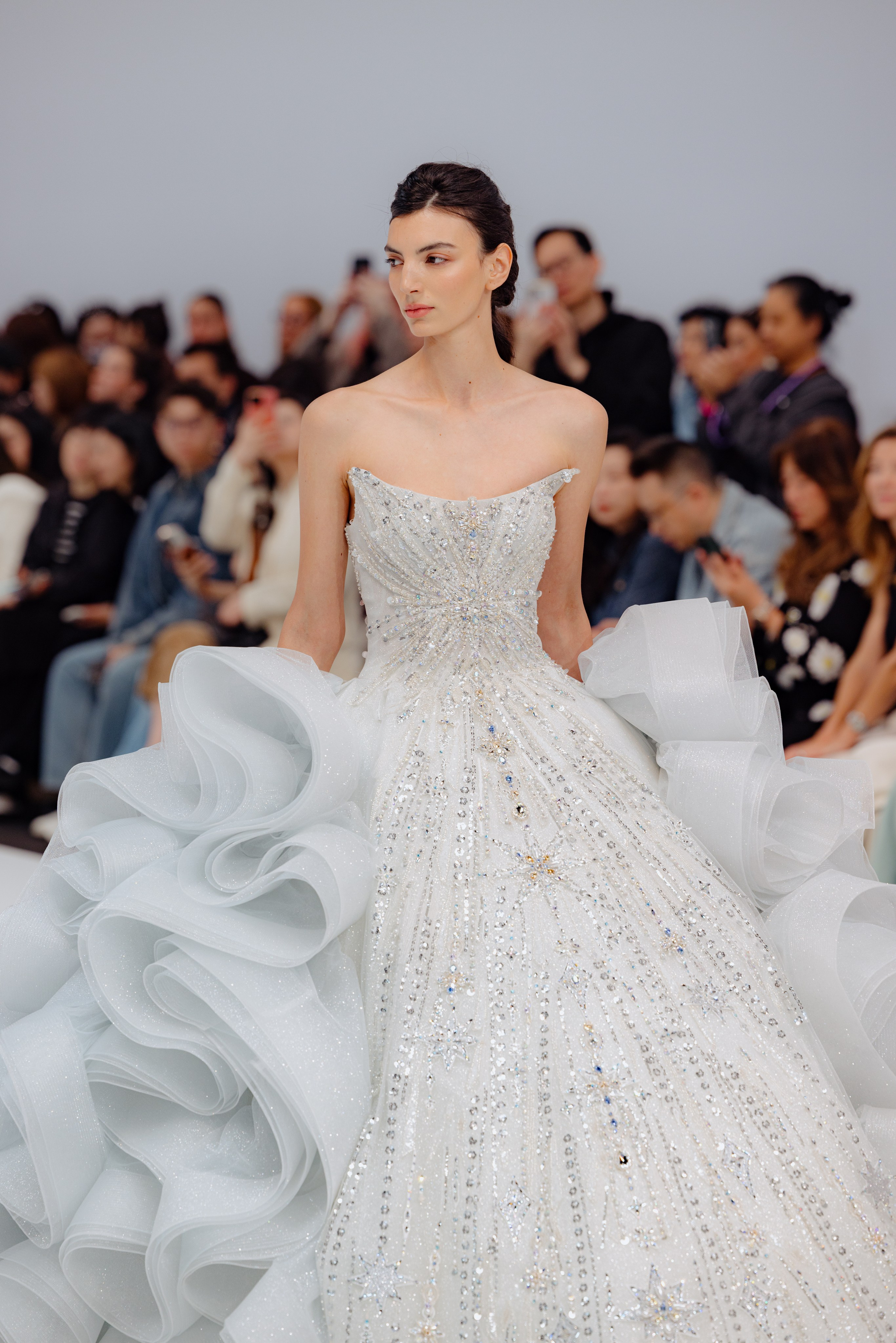 Elegant wedding dress detail with floral embroidery at BBFW 2025