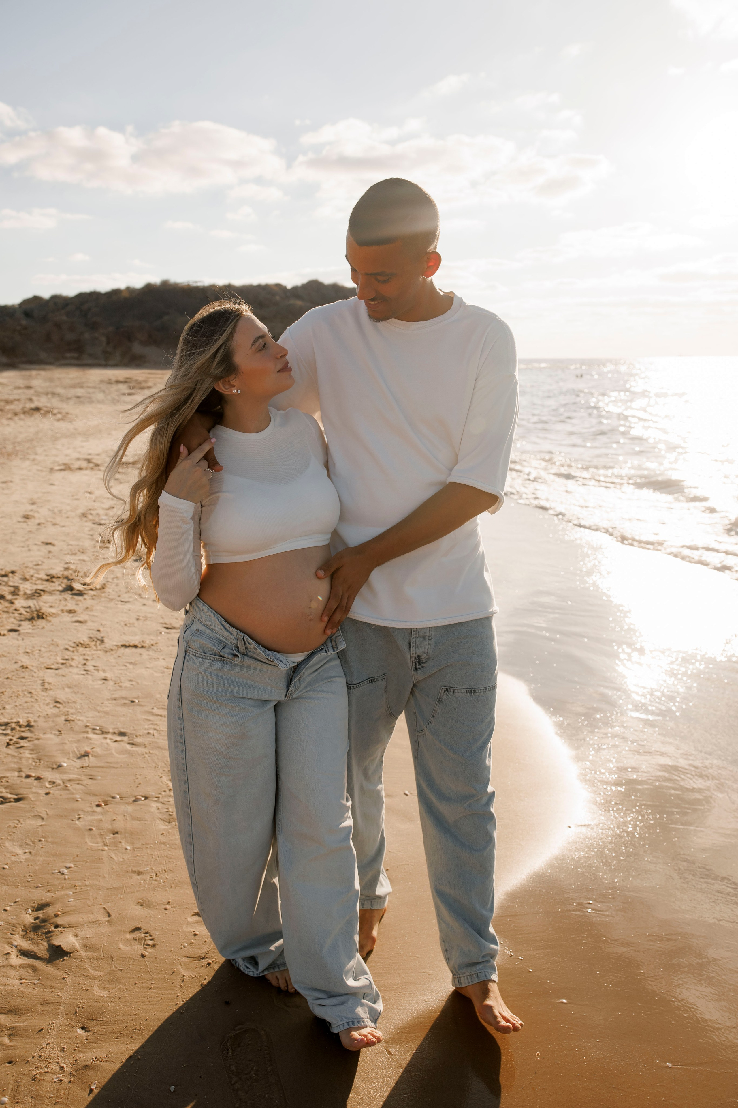 Pregnancy photoshoot near the sea. Wedding and family photographer