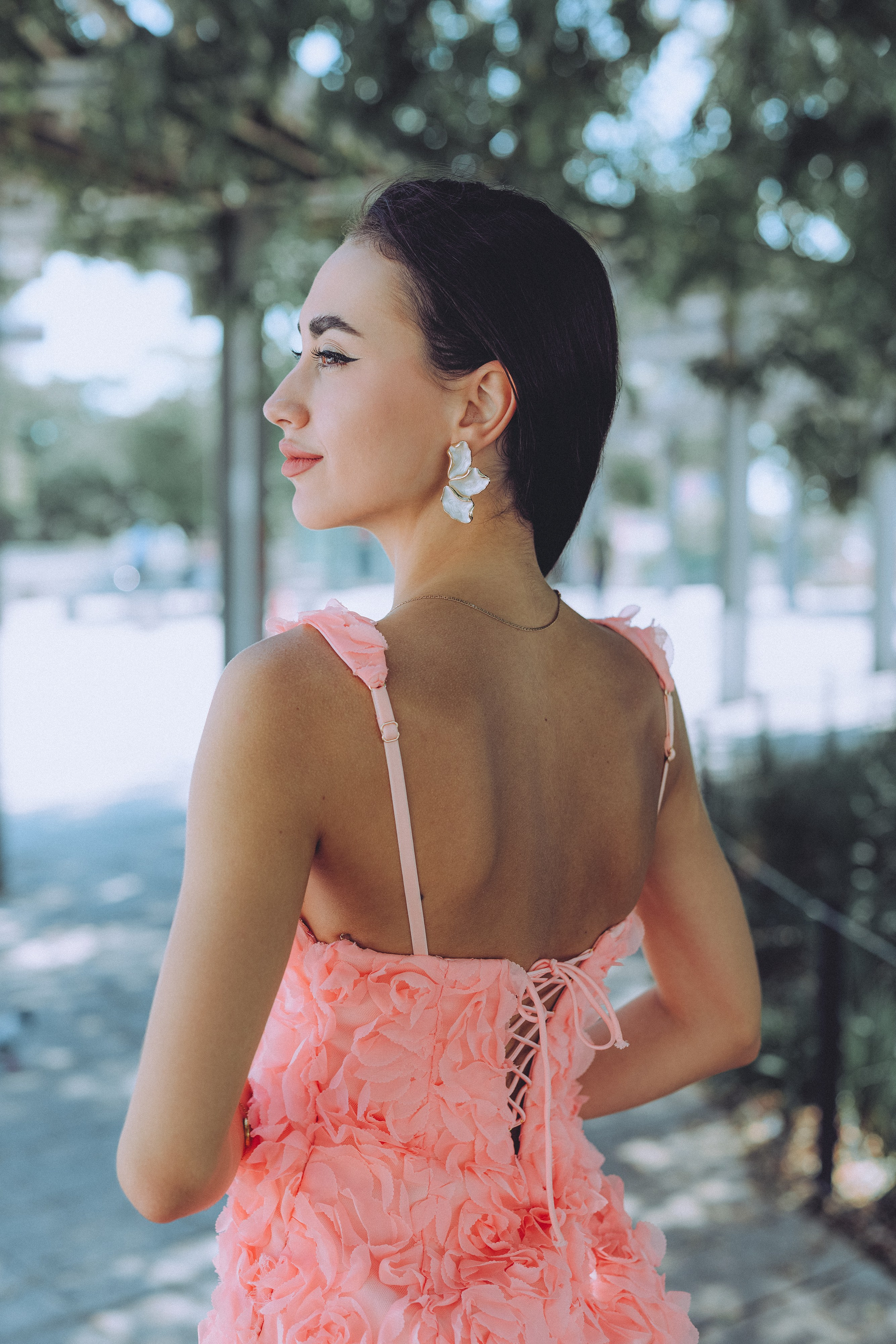 Barcelona lifestyle portrait of a woman in a light pink summer dress.