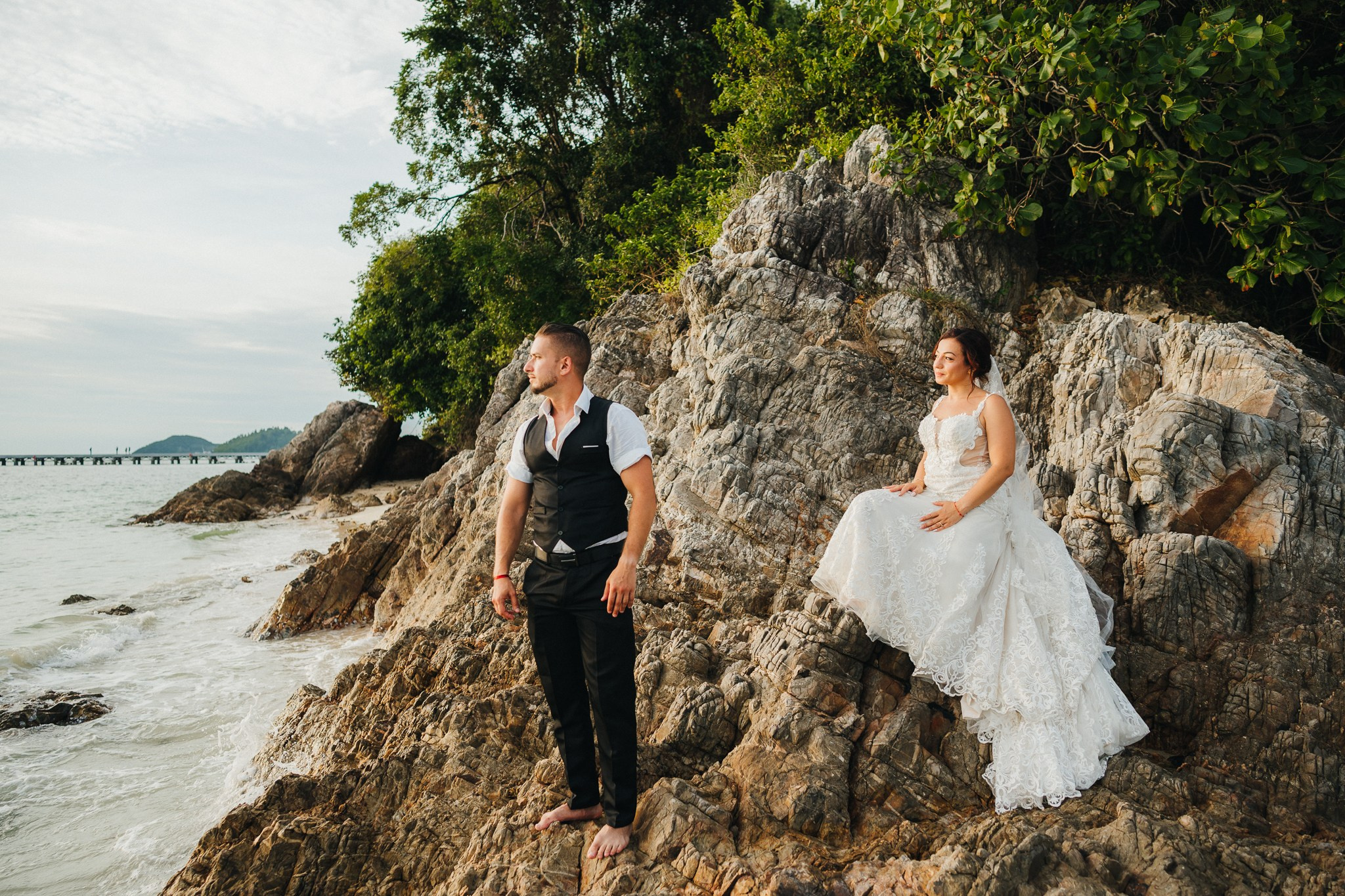 Intimate family wedding on the beach in Koh Samui, Thailand with the couple and their children enjoying the ceremony together