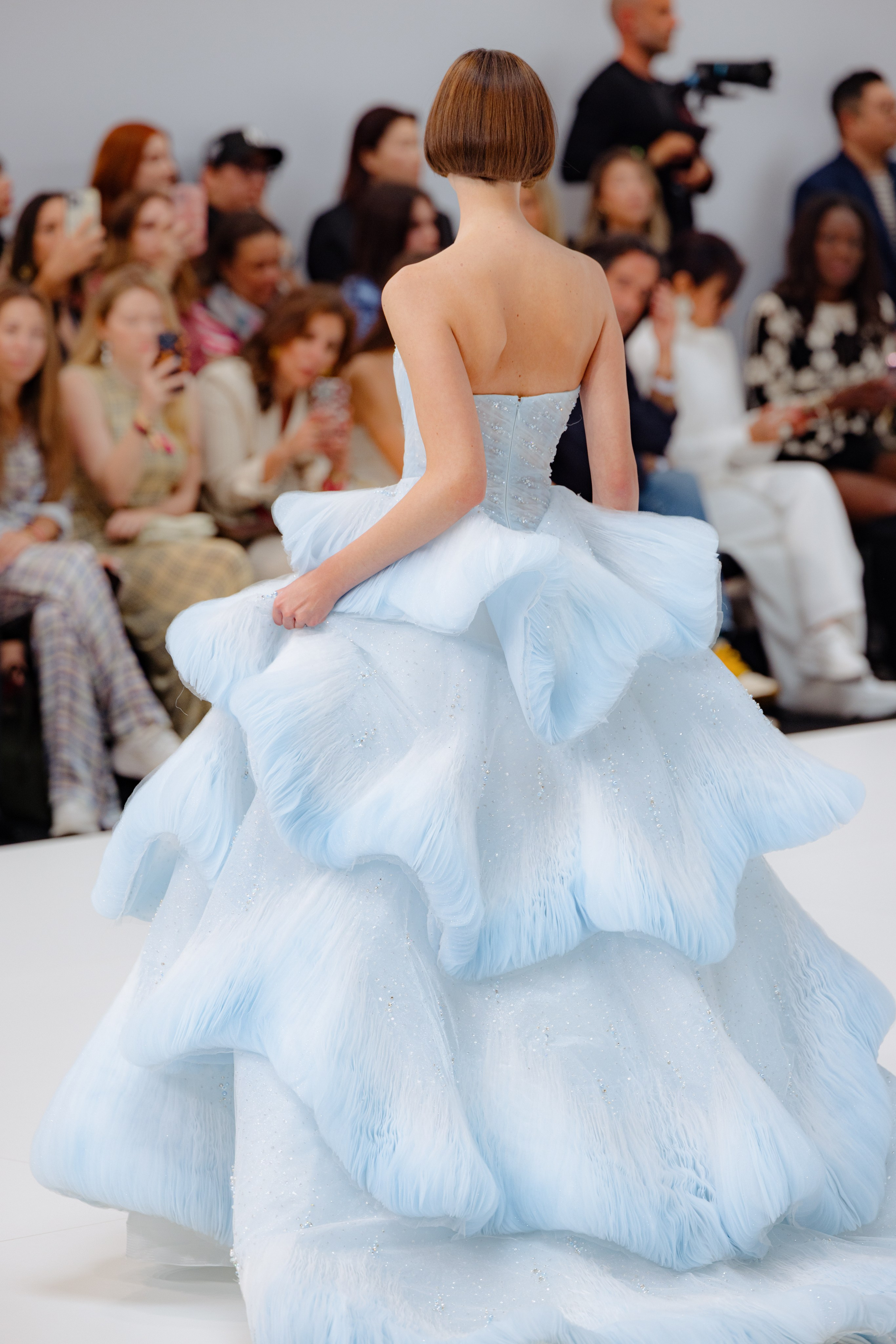 Fashion photographer capturing candid moment backstage at BBFW