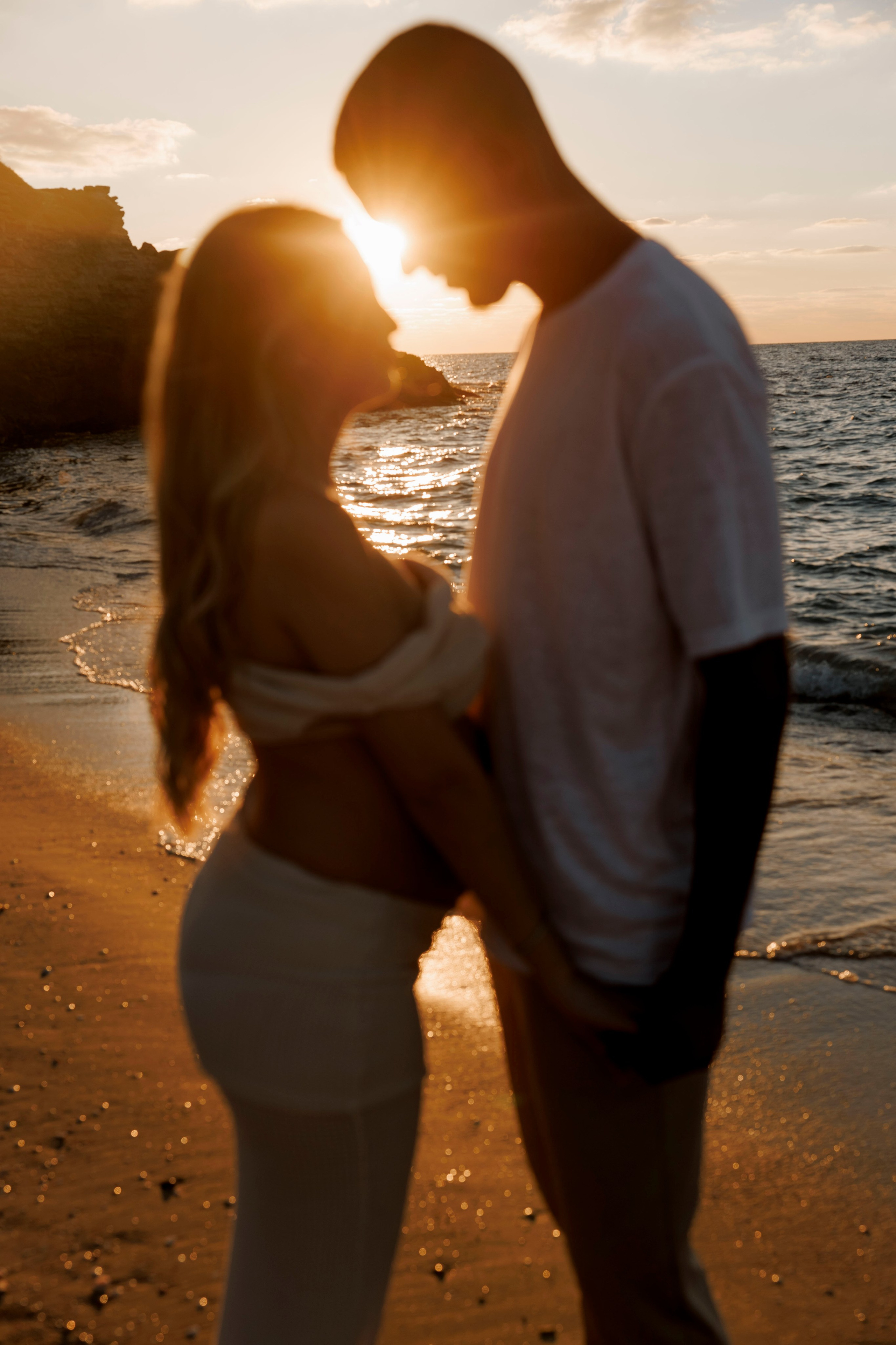 Pregnancy photoshoot near the sea. Wedding and family photographer