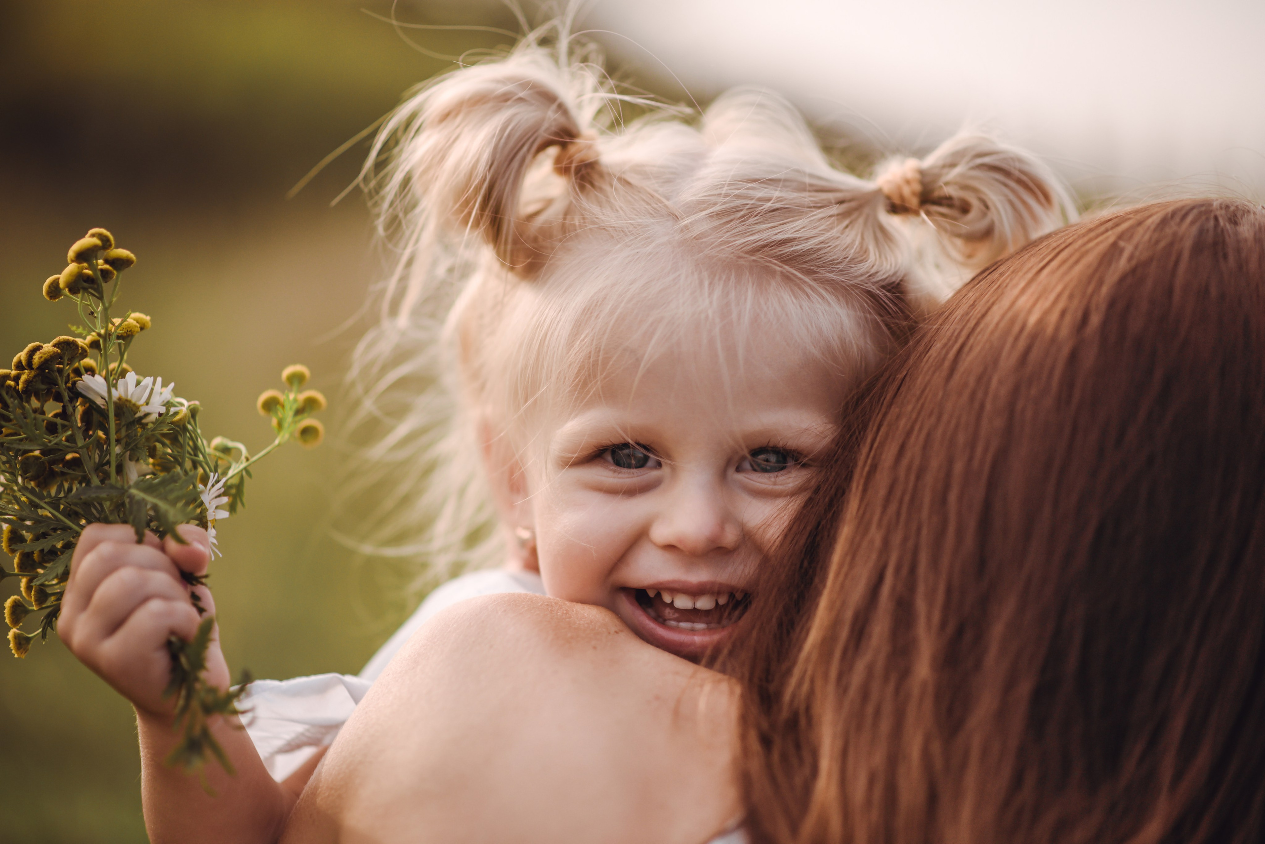 Girl looking at the camera in a meadow