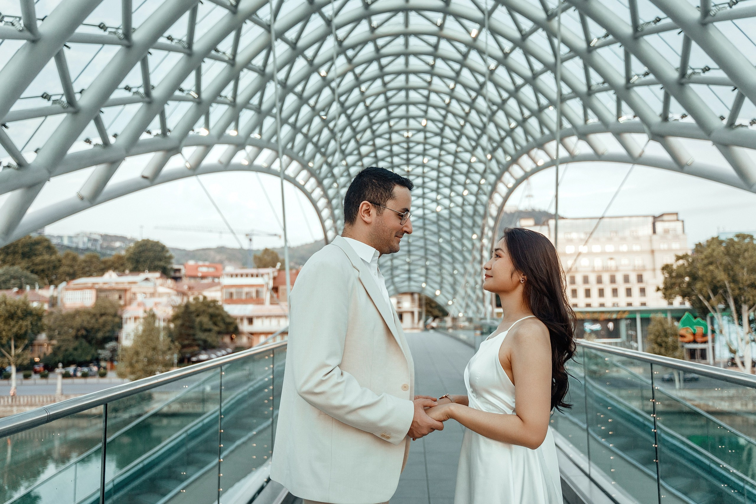 Alaeddine & Matika on the Peace Bridge in Tbilisi. Photographer Sergey Otkrytyi in Batumi & Tbilisi