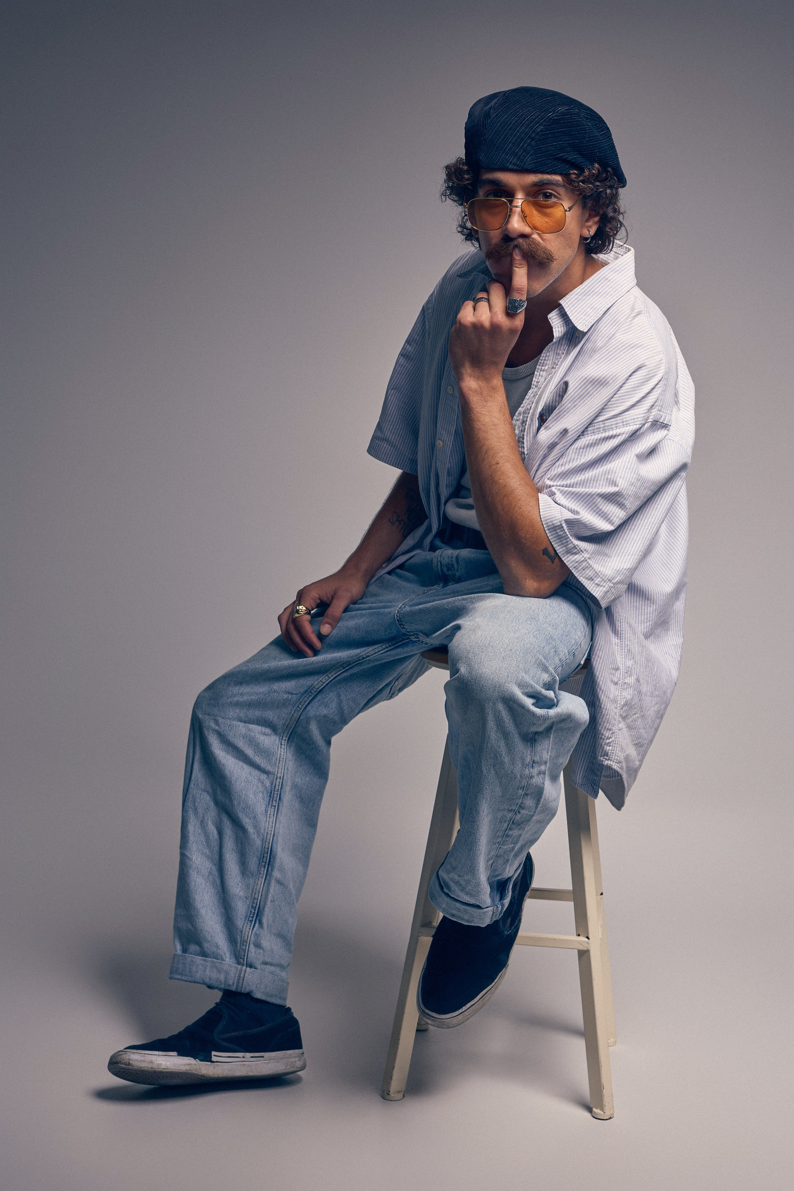 Retro inspired photo of male model in dark setting