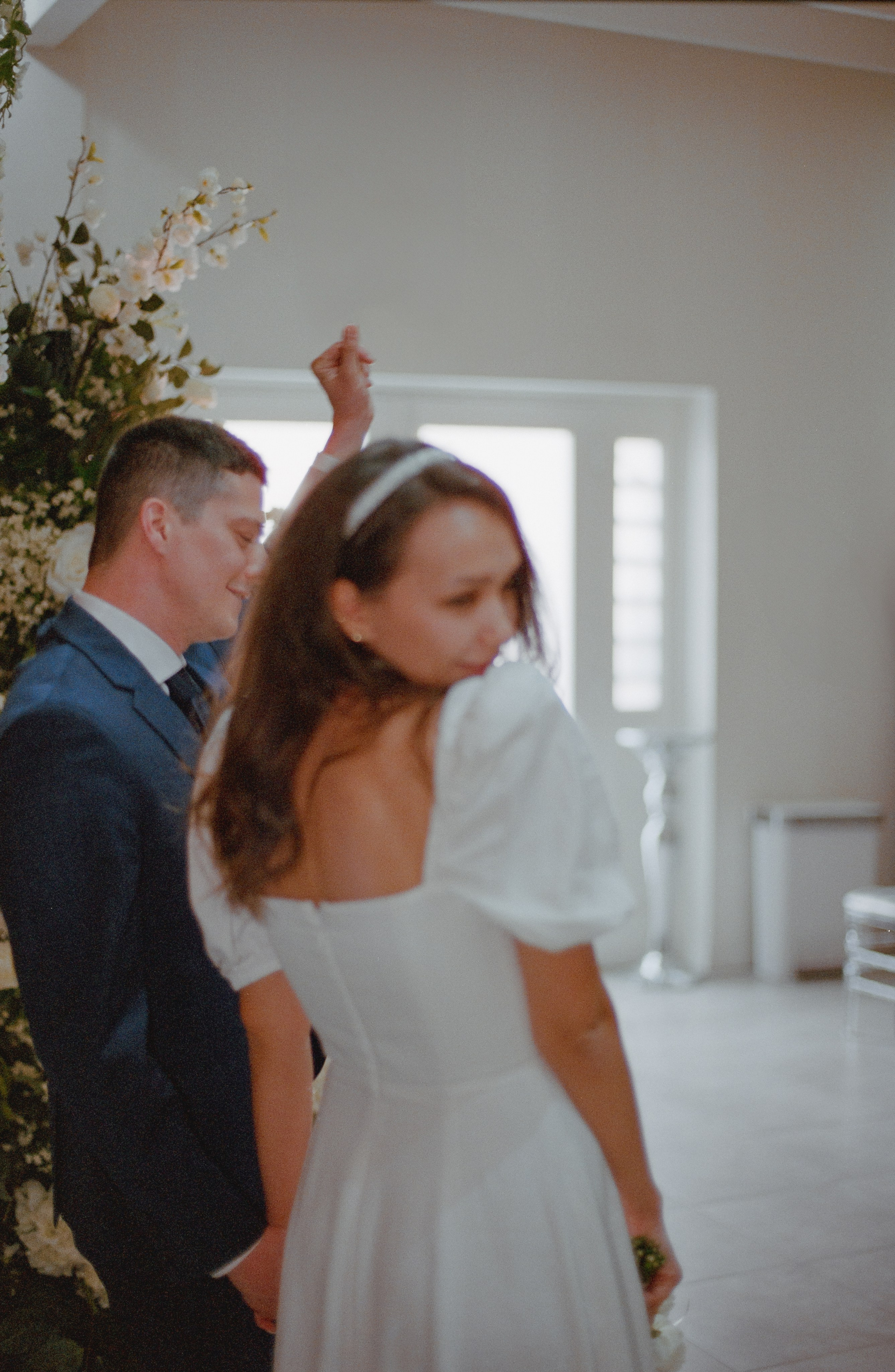 a bride and groom dancing to the music in a wedding chapel