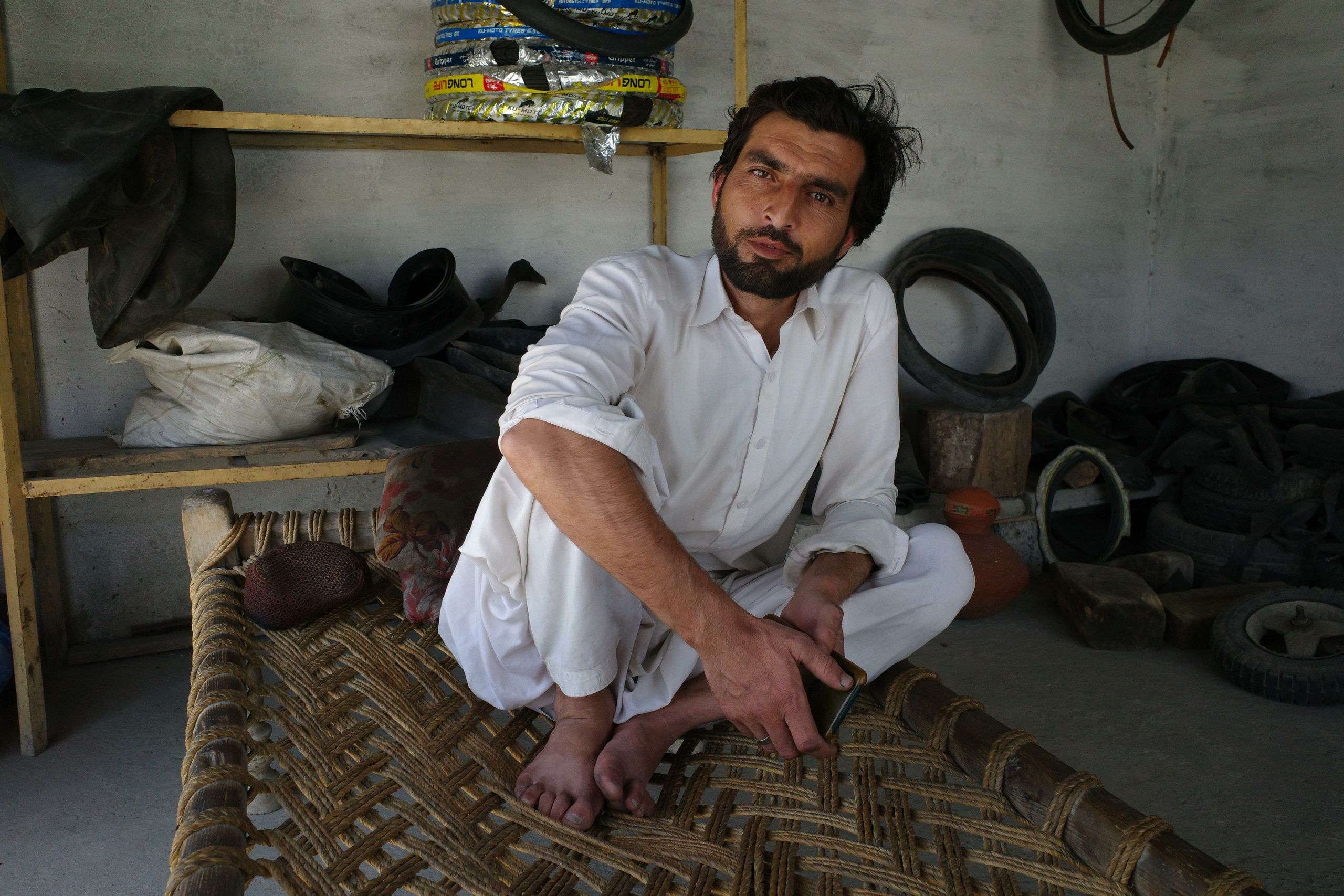 Mechanic at a service station on the road to Peshawar