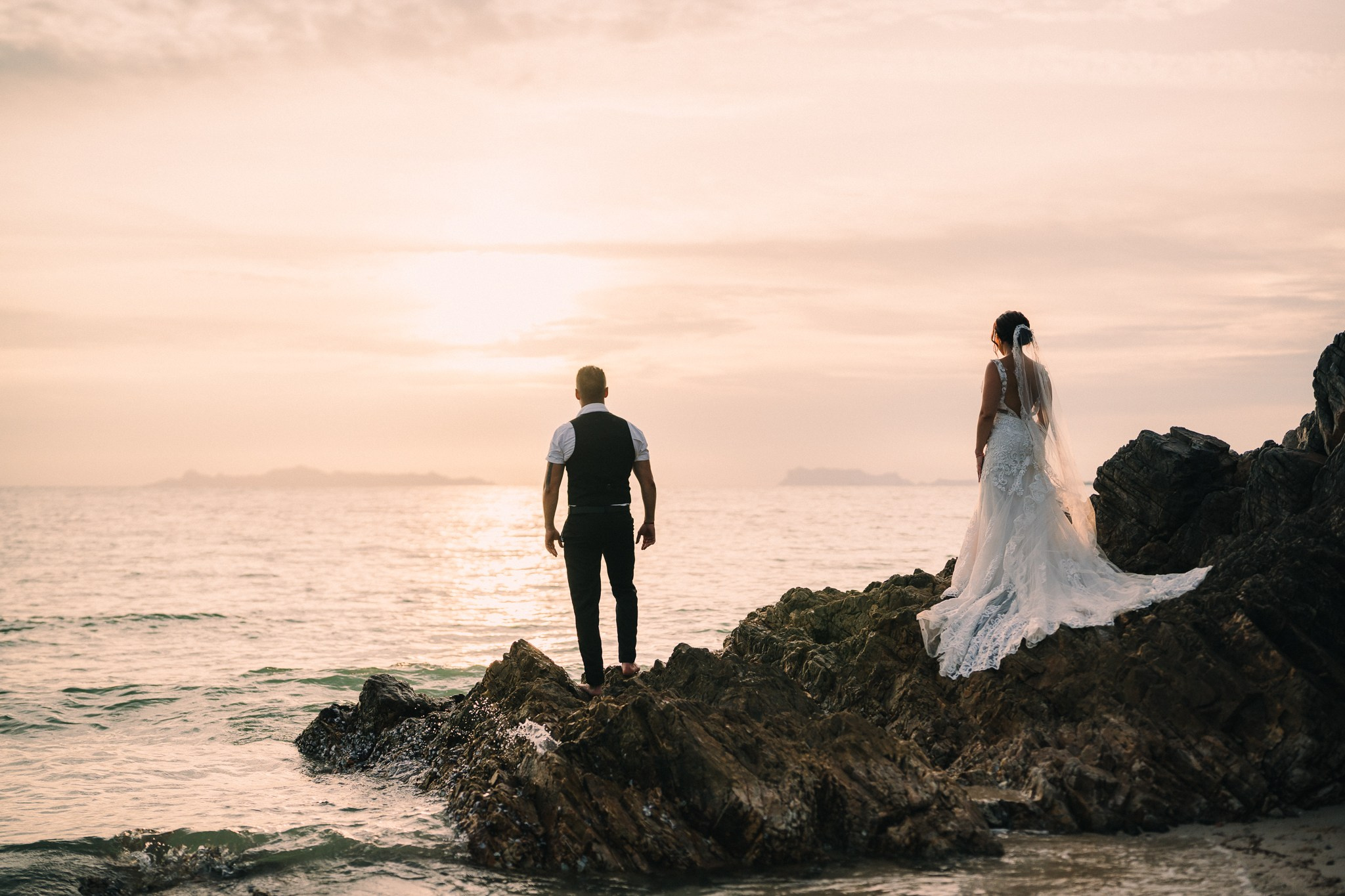 Intimate family wedding on the beach in Koh Samui, Thailand with the couple and their children enjoying the ceremony together