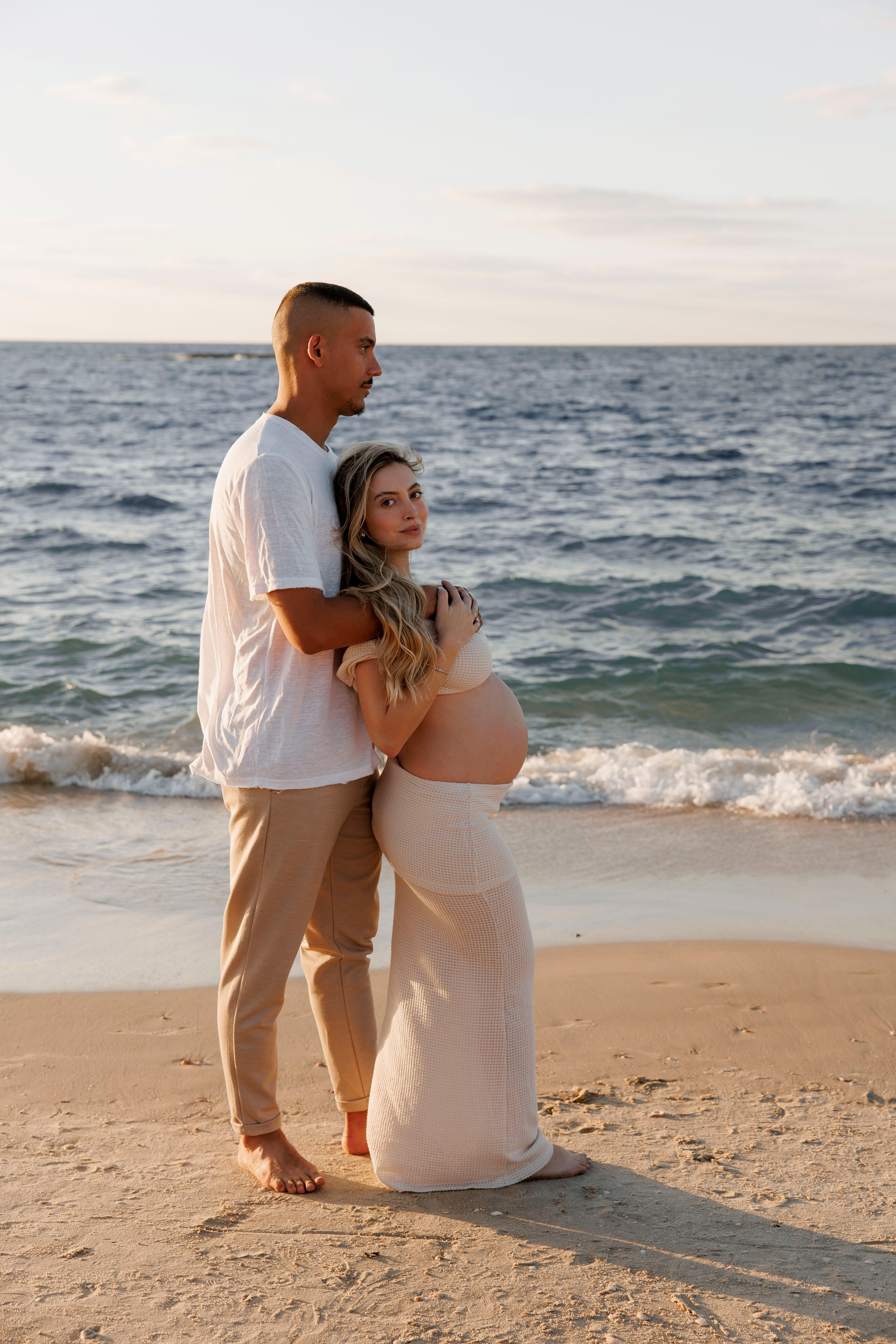 Pregnancy photoshoot near the sea. Wedding and family photographer