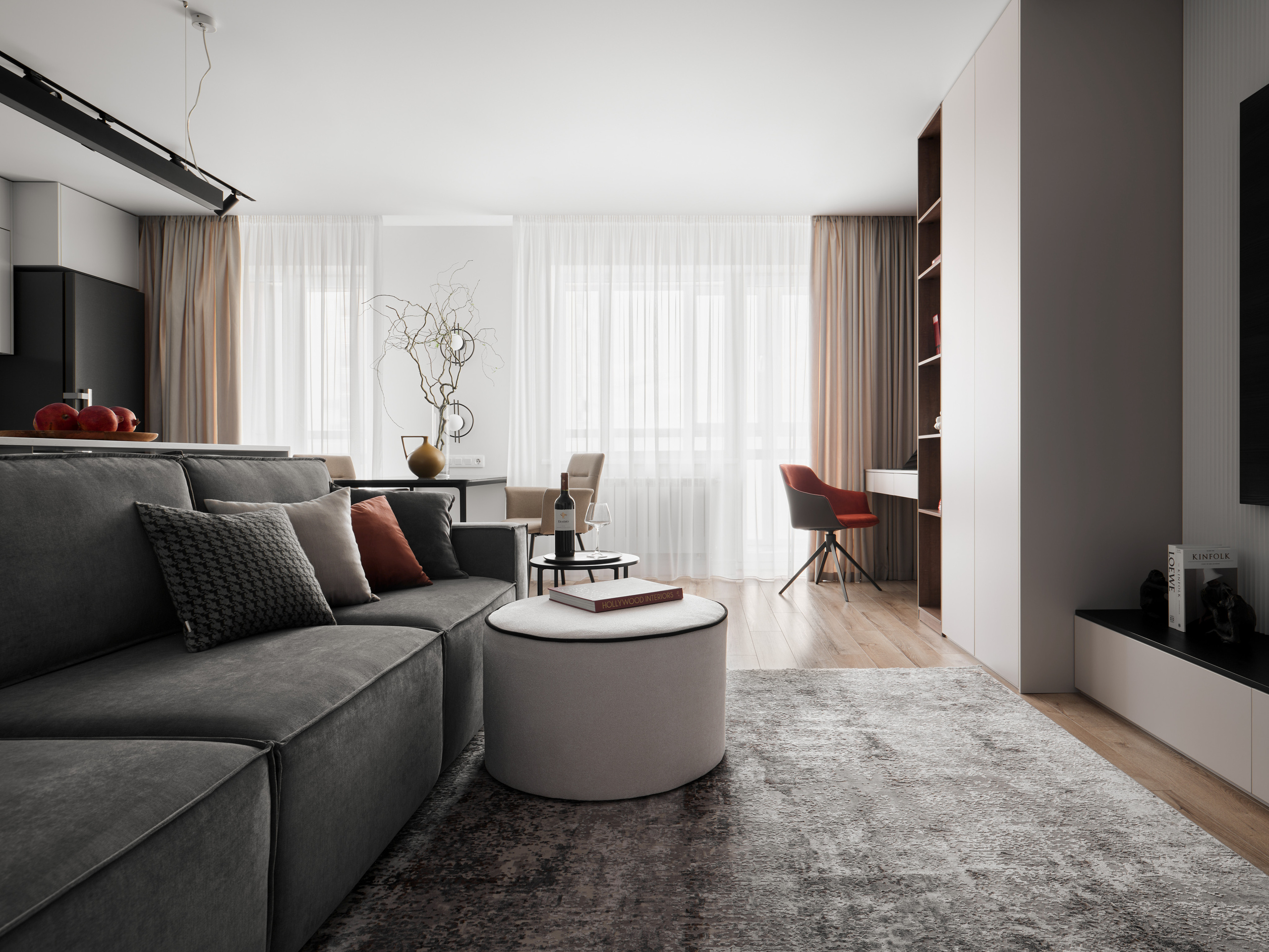 Просторная гостиная-кухня с серым диваном, большим окном с бежевыми шторами и рабочим местом. Интерьер квартиры от дизайнера Екатерины Мищенко, фотография Сергея Денисенко.