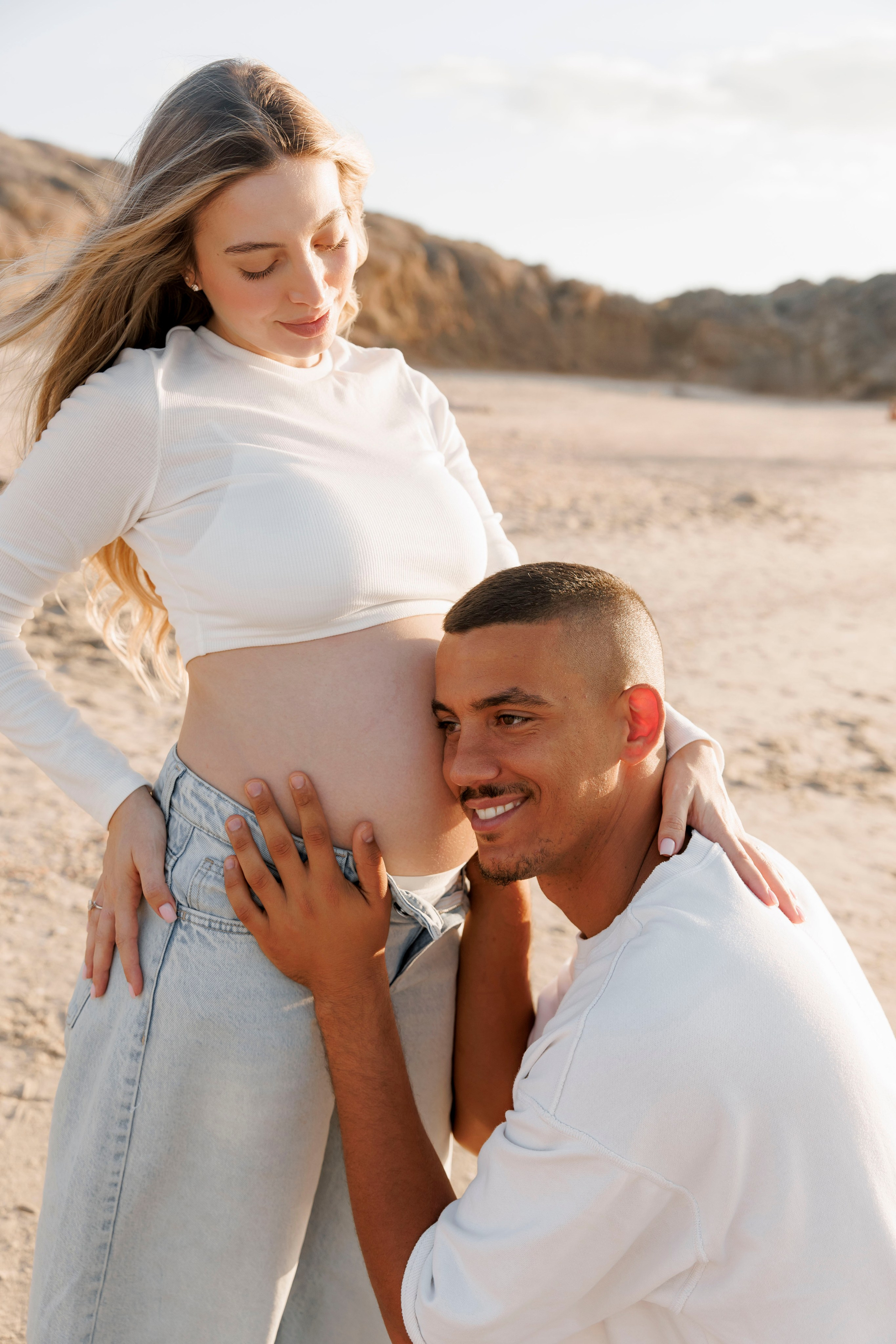 Pregnancy photoshoot near the sea. Wedding and family photographer