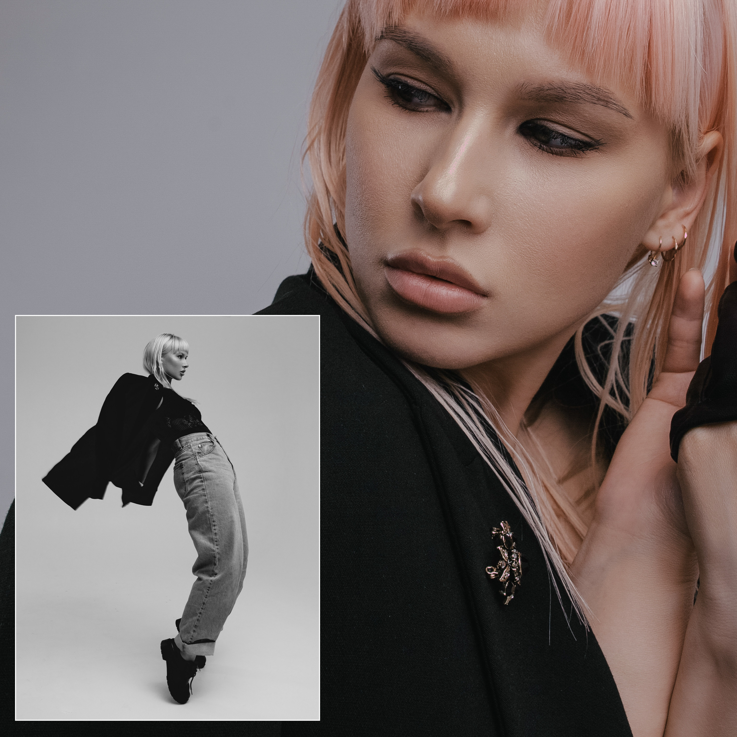 Девушка в джинсах и пиджаке прыгает и стоит на носочках.