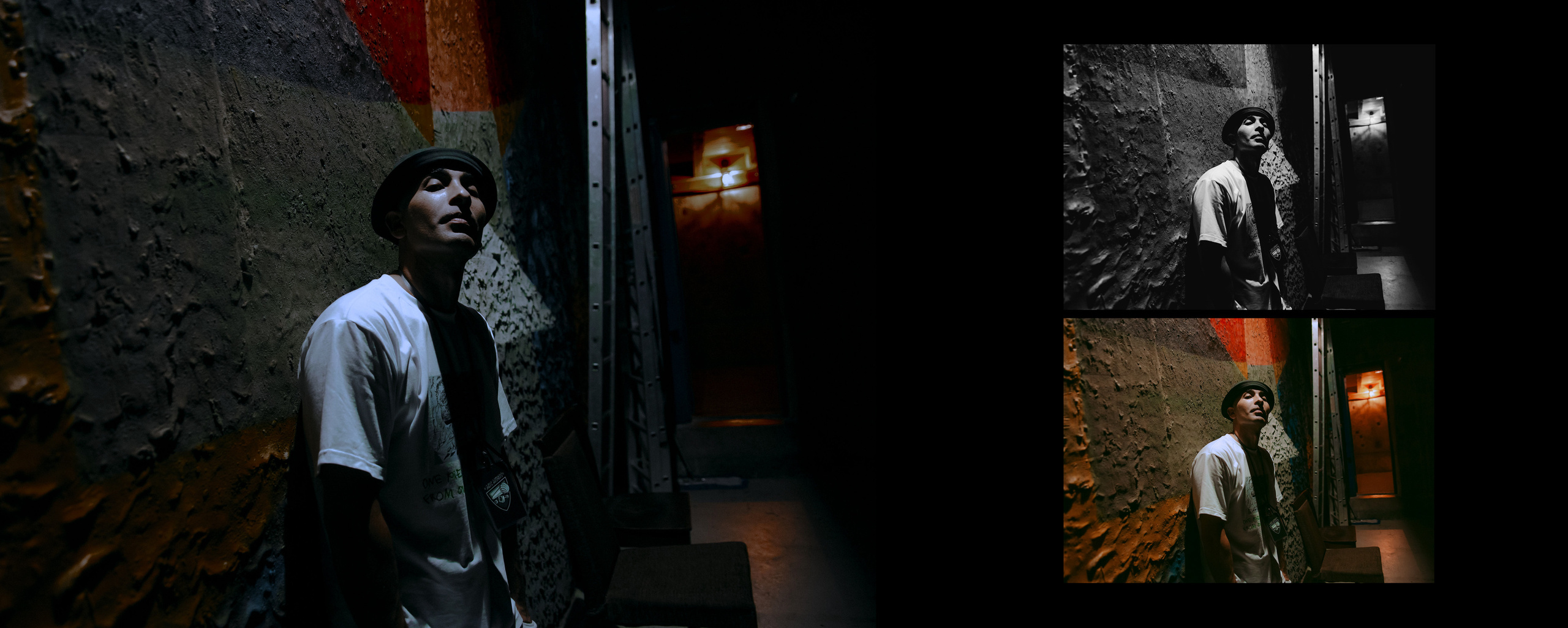 Рэпер в панаме и белой футболке стоит у стены клуба "Подземка".