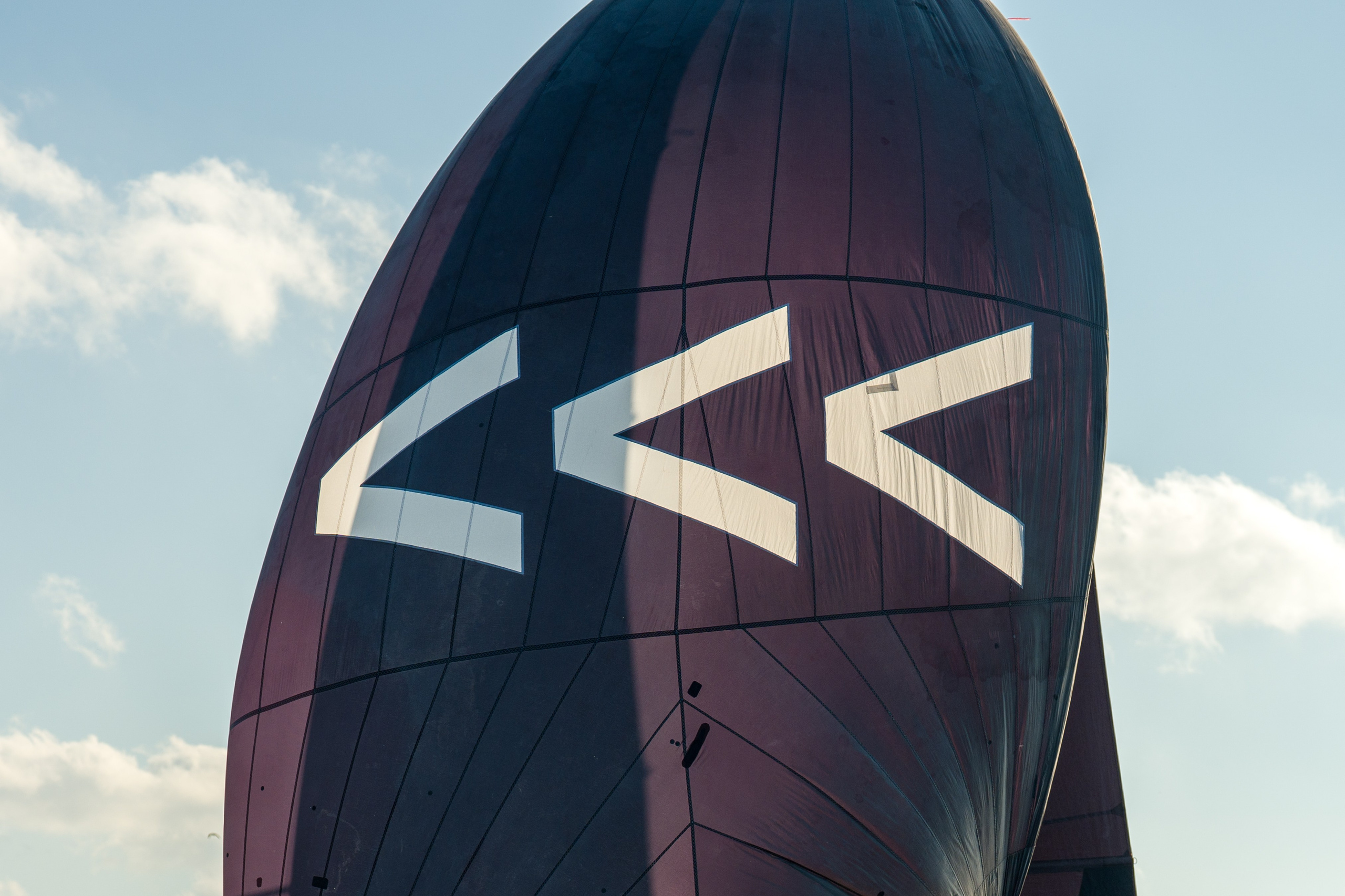 Black SV20 spinnaker fills with wind mid-race on the course