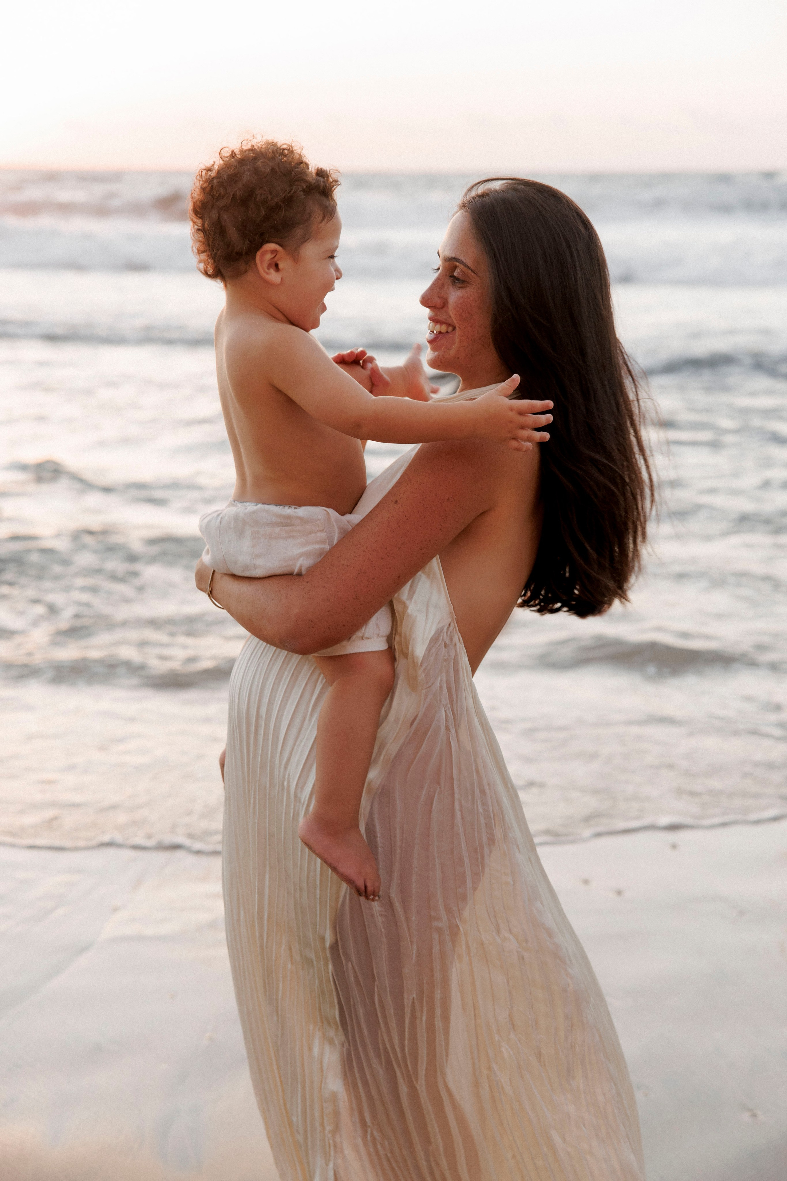 Pregnancy photoshoot near the sea. Wedding and family photographer