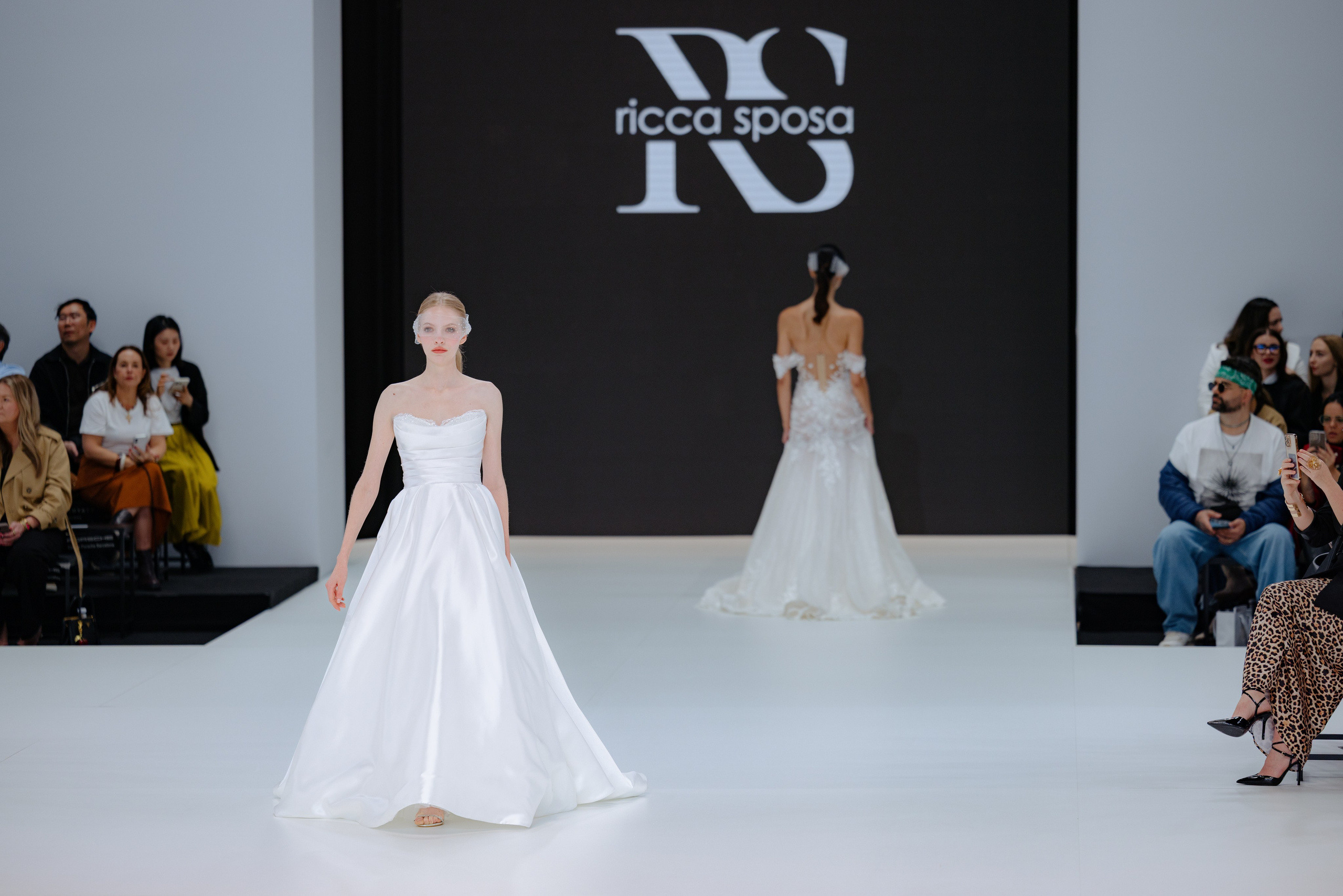 Luxurious tulle train captured during bridal catwalk in Barcelona