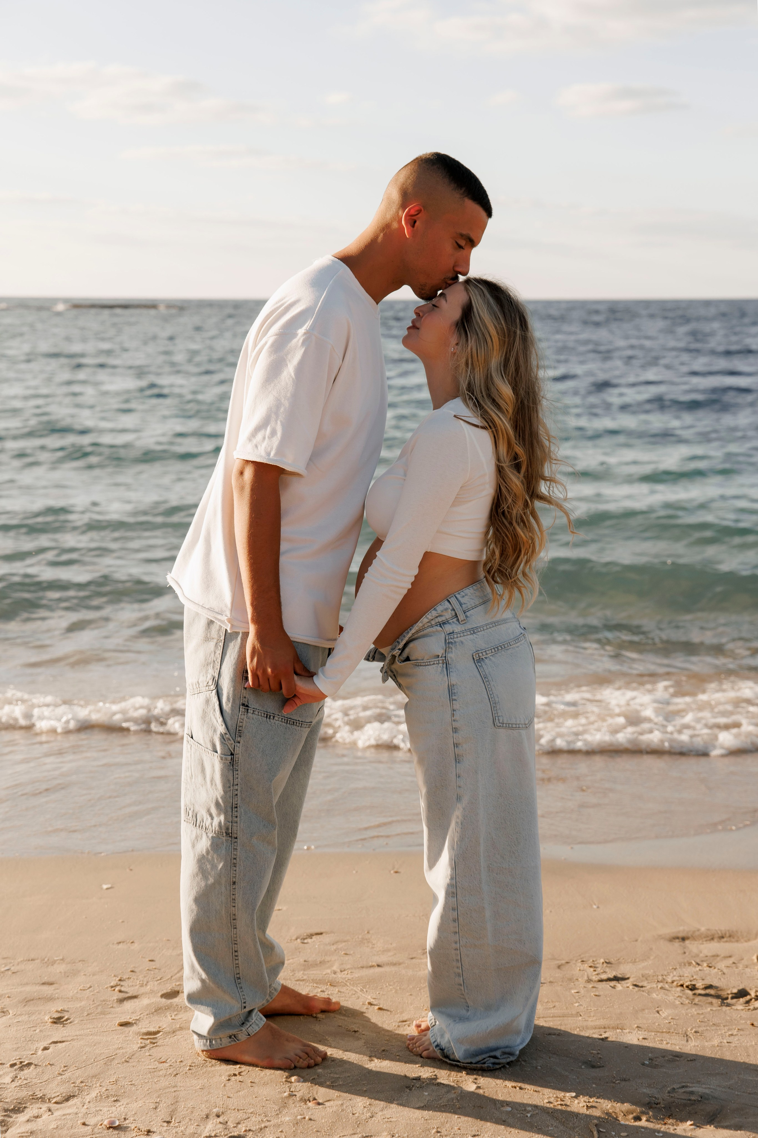 Pregnancy photoshoot near the sea. Wedding and family photographer