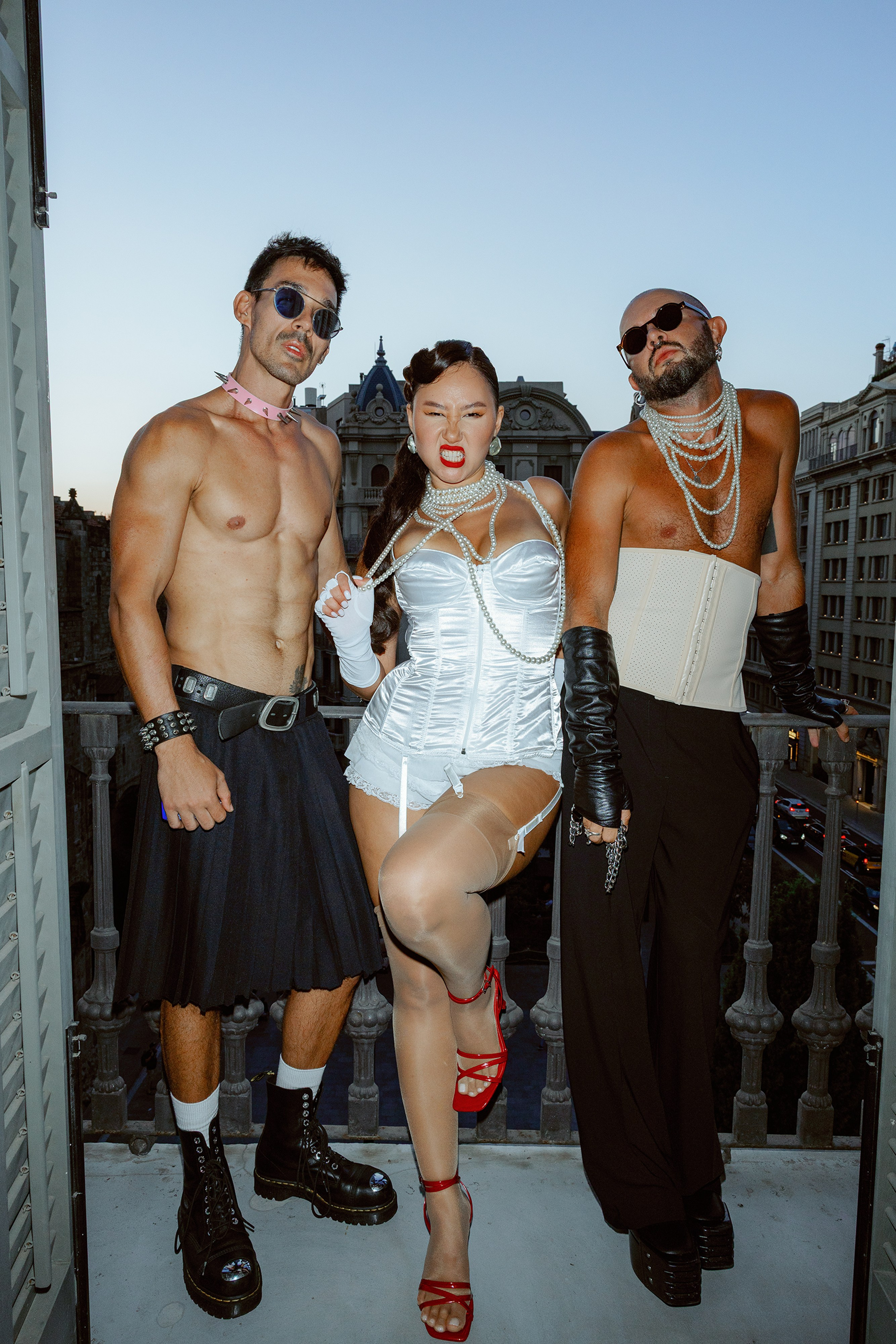 Candid moment of guests dancing under string lights