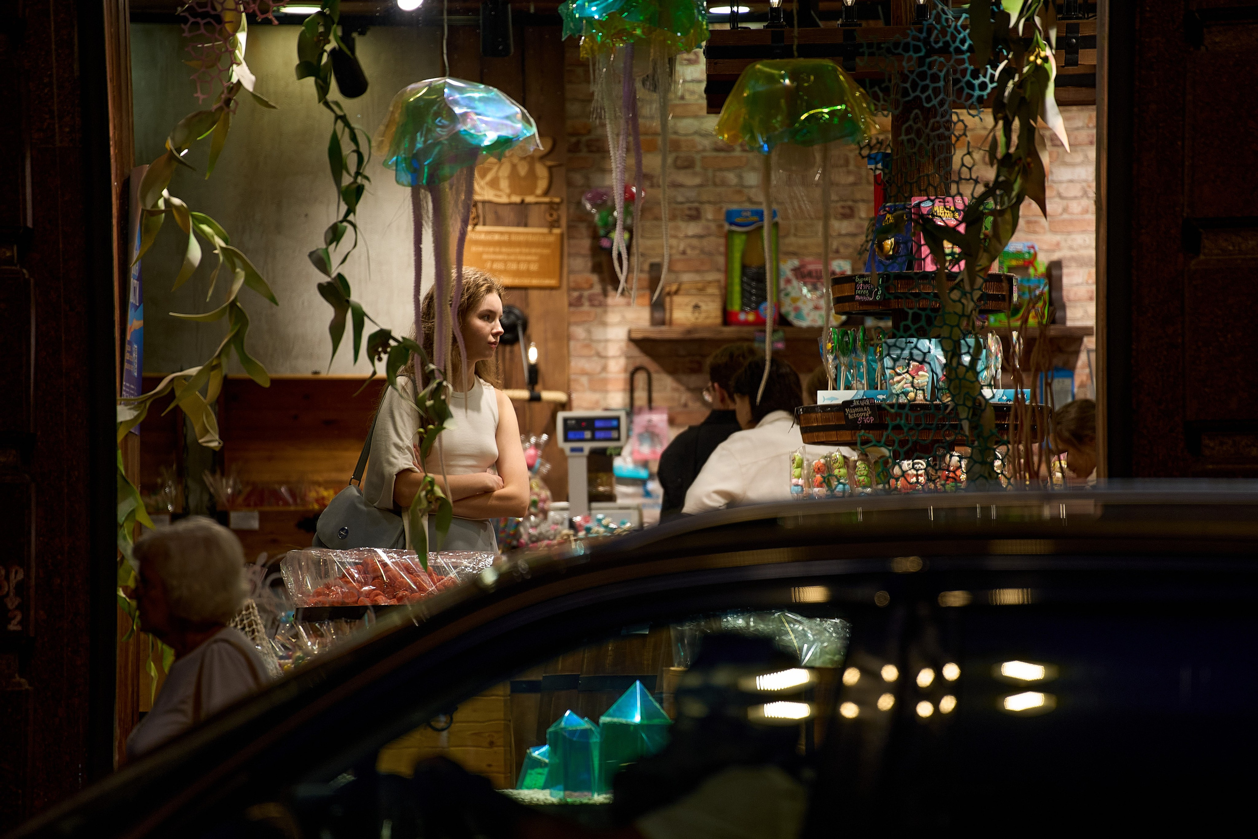 A confectionery shop and its visitors in Kitai-Gorod. Street photography from street photographer Alexander Gladky.