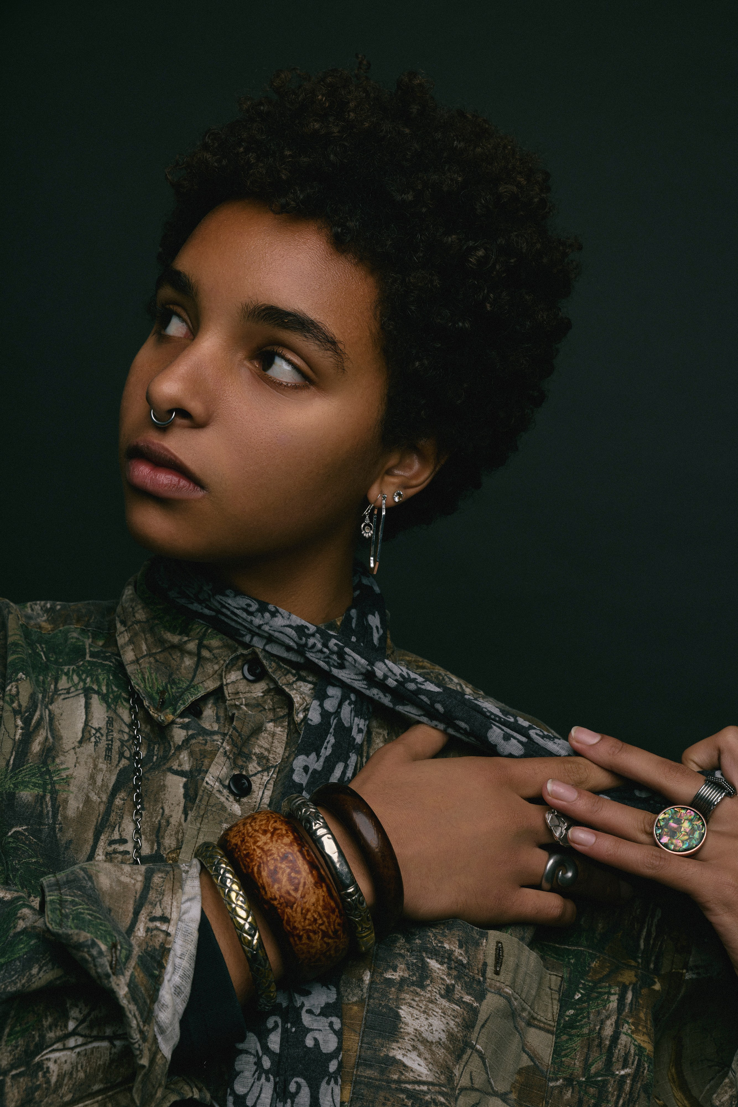 Creative portrait of a woman with expressive look in controlled studio light