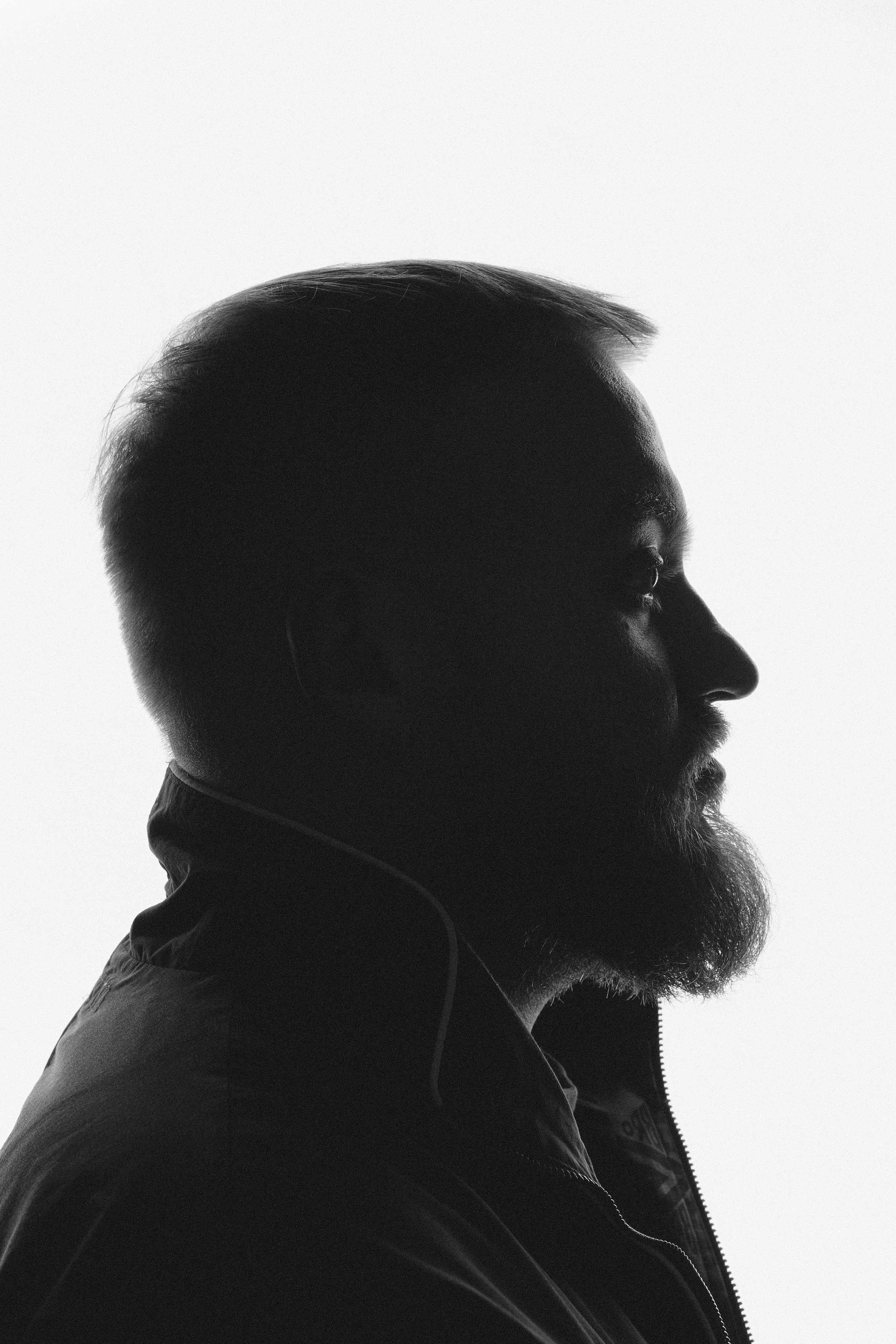 High-quality studio headshot of Pavel Dedishchev for press materials