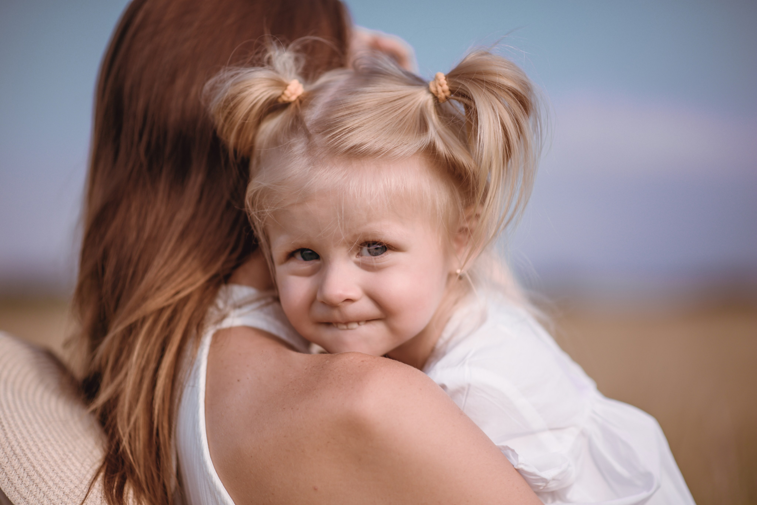 Girl looking at the camera in a meadow